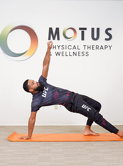 Patient performing stretching exercise during physical therapy in Houston.