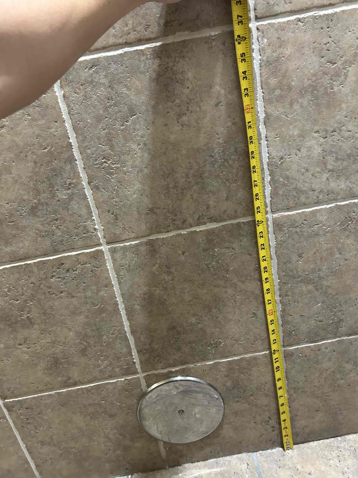 A lingering unpleasant bathroom smell, possibly from plumbing issues like a faulty bathtub sink stopper, permeates the air, highlighting the need for maintenance of bathroom stall partition hardware and overall sanitation for a fresher restroom experience.