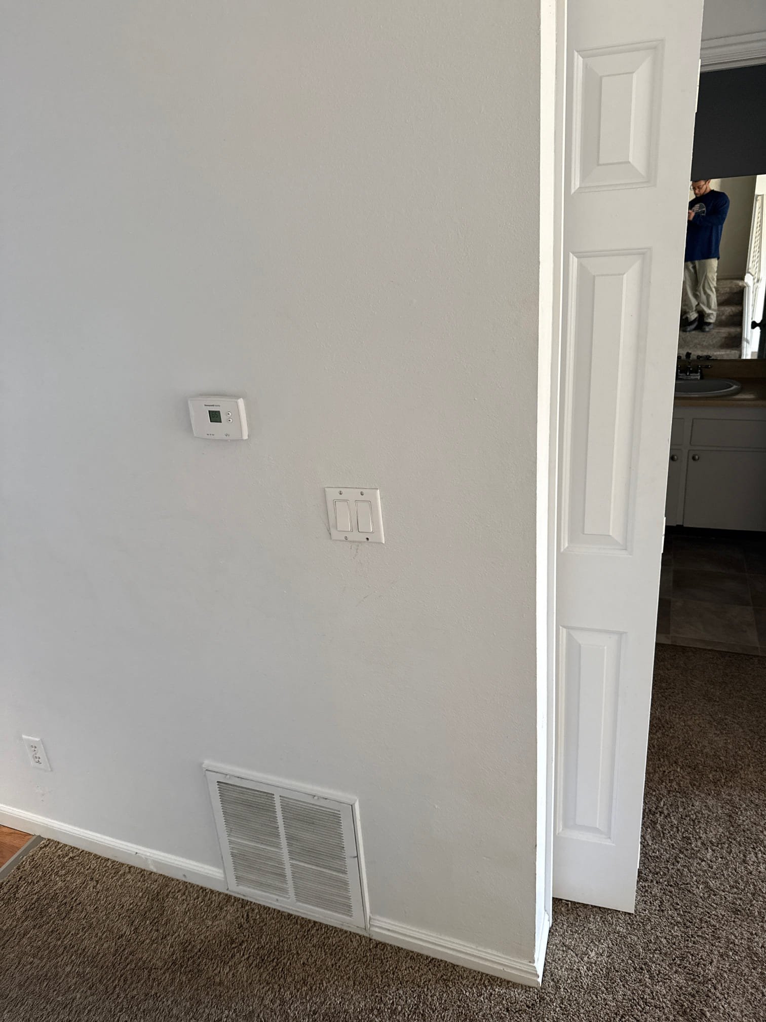 Close-up of an HVAC technician performing preventive maintenance on an air conditioning unit. This routine maintenance, part of an air conditioning service, ensures optimal performance and efficiency. Regular air conditioning annual maintenance helps prevent costly repairs and extends the lifespan of your AC system.