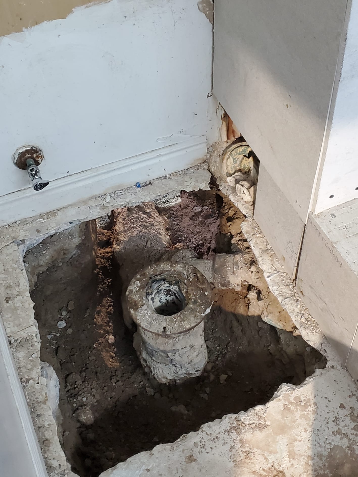 Exterior drainage pipe, possibly inspected via sewer scope camera as part of commercial sewer inspection maintenance. Ensuring proper drainage is crucial for preventing costly damage and maintaining property value.