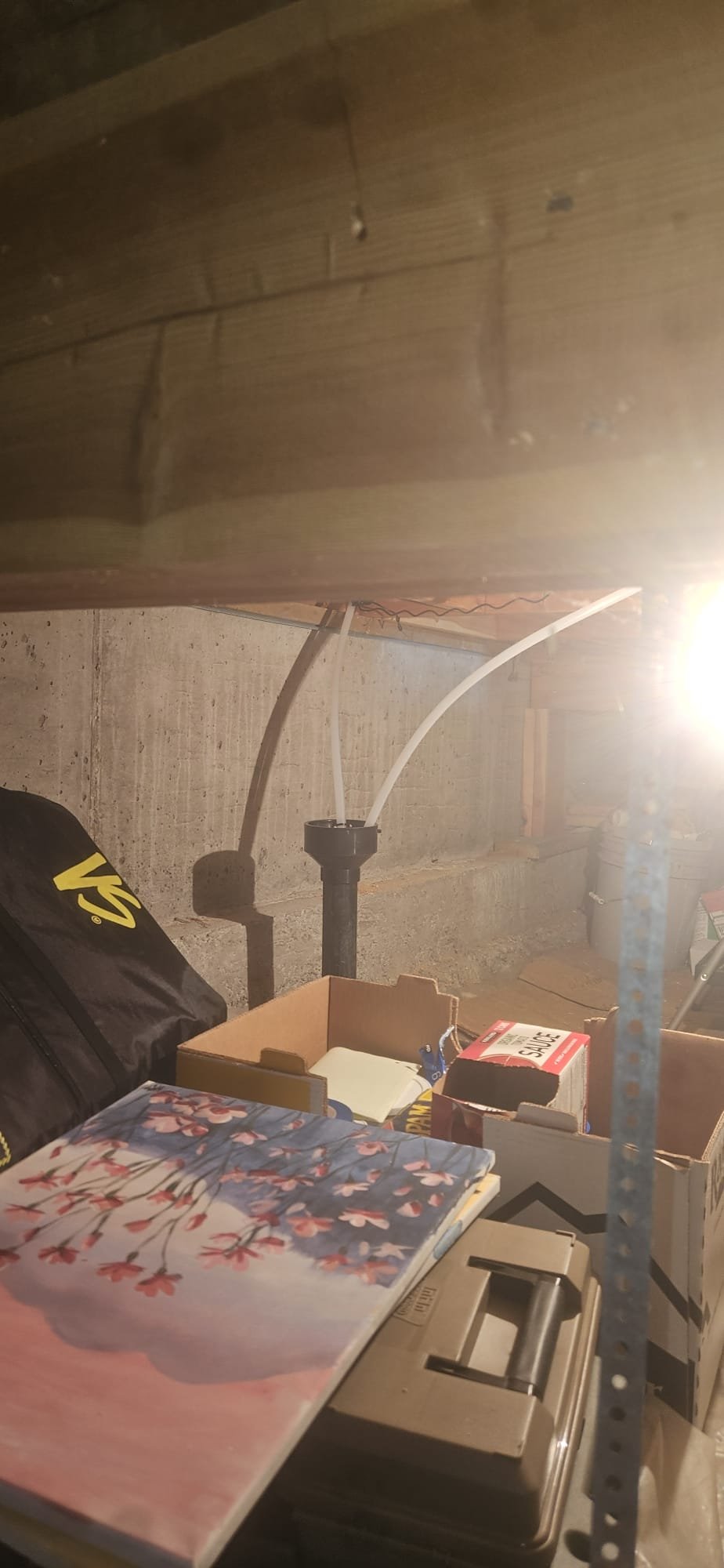 Close-up of a water softener salt tank during maintenance, highlighting the importance of regular water softener maintenance service to prevent costly repairs. Proper salt levels and tank cleaning are key to efficient operation and minimizing water softener maintenance cost.