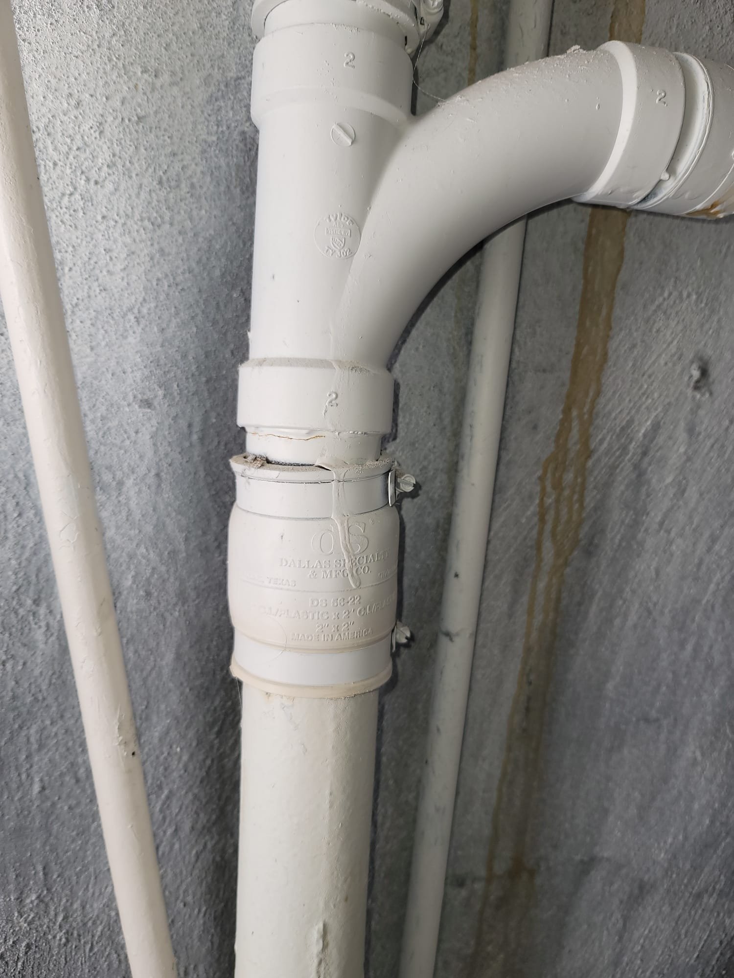 Image depicting commercial drywall repair after water damage, possibly related to water softener issues. Focus on odor removal and the importance of professional inspection to diagnose the source and ensure proper remediation. Highlights solutions and water softener options to prevent future damage.