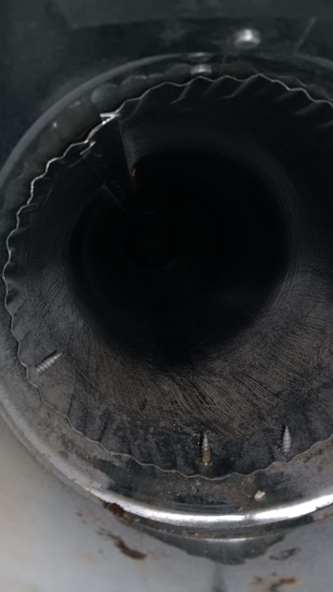 Ductless mini split repair. A technician services a ductless air conditioner, highlighting efficient air conditioners repair for ductless systems.