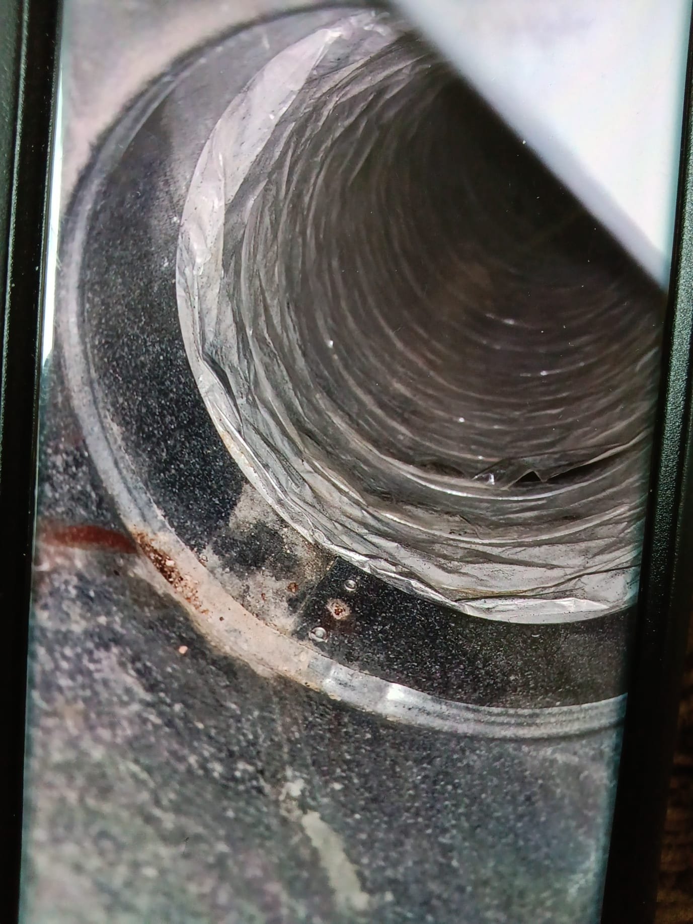 Close-up of a backflow prevention system, vital for maintaining water quality and system efficiency during HVAC and ductless system inspections, ensuring optimal performance and preventing contamination.
