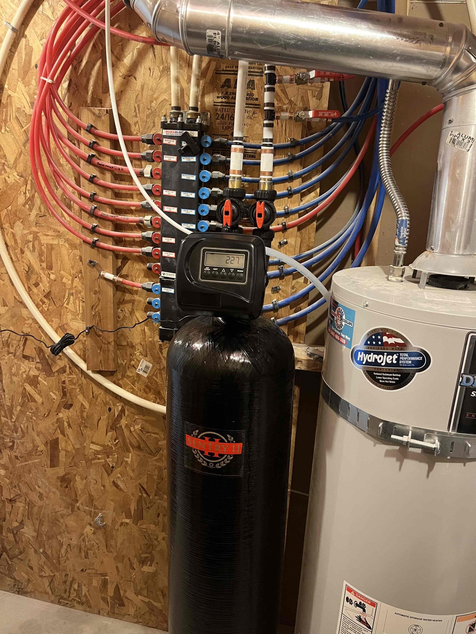 Image depicting water softener system installation by professional plumbers. Experts in water softener installation ensuring clean, soft water for your home. Find reputable companies that install water softeners for optimal water quality.
