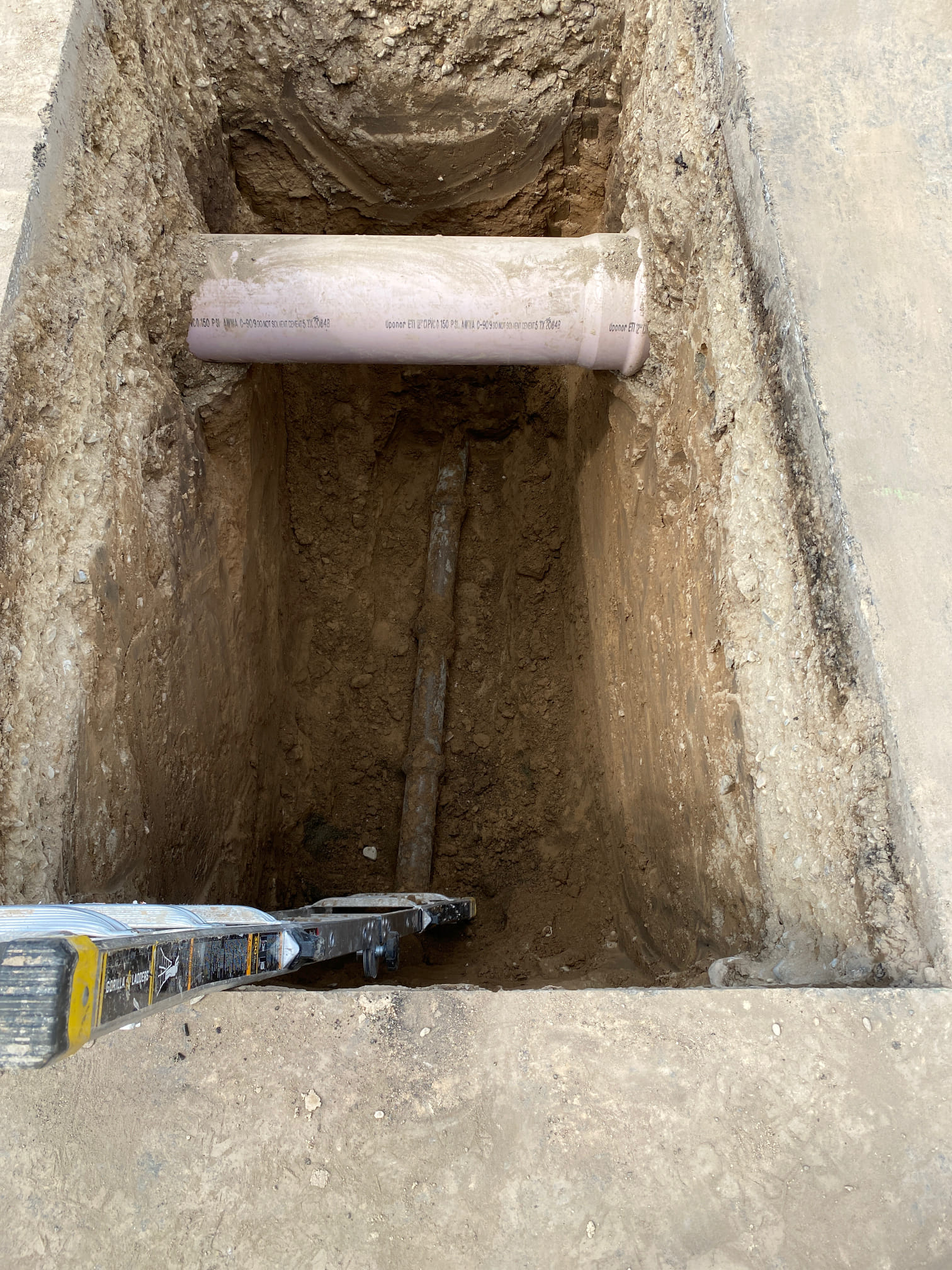Close-up of a bathtub faucet leaking, indicating a need for repair. A faucet wrench might be required to fix the tub faucet dripping and stop the water waste.