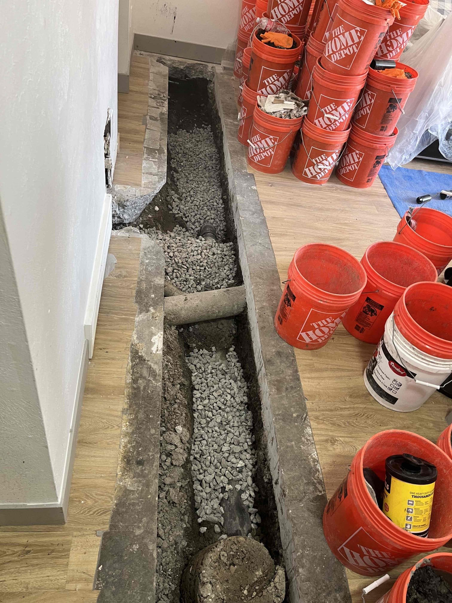 Basement ceiling showing water damage and mold growth around a ceiling vent, indicating a need for water damage repair services. Addressing basement ceiling water damage is crucial to prevent further mold issues and structural problems.