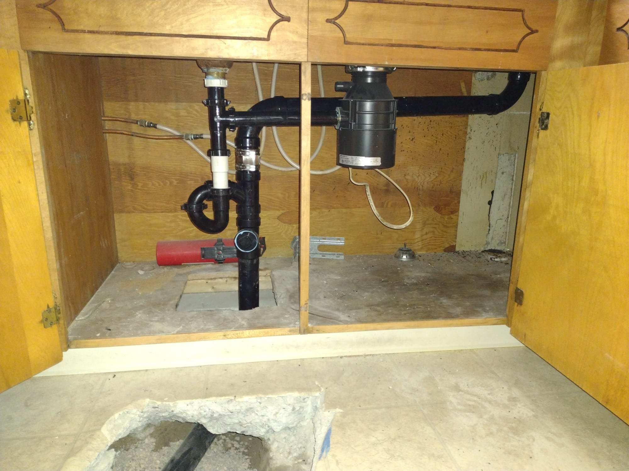 Image depicting a home being restored after a flood, emphasizing emergency residential flood cleanup services. In the background, a whole home water filtration system is visible, subtly highlighting the importance of clean water post-flood. Search 'residential flood cleanup near me' for immediate assistance.