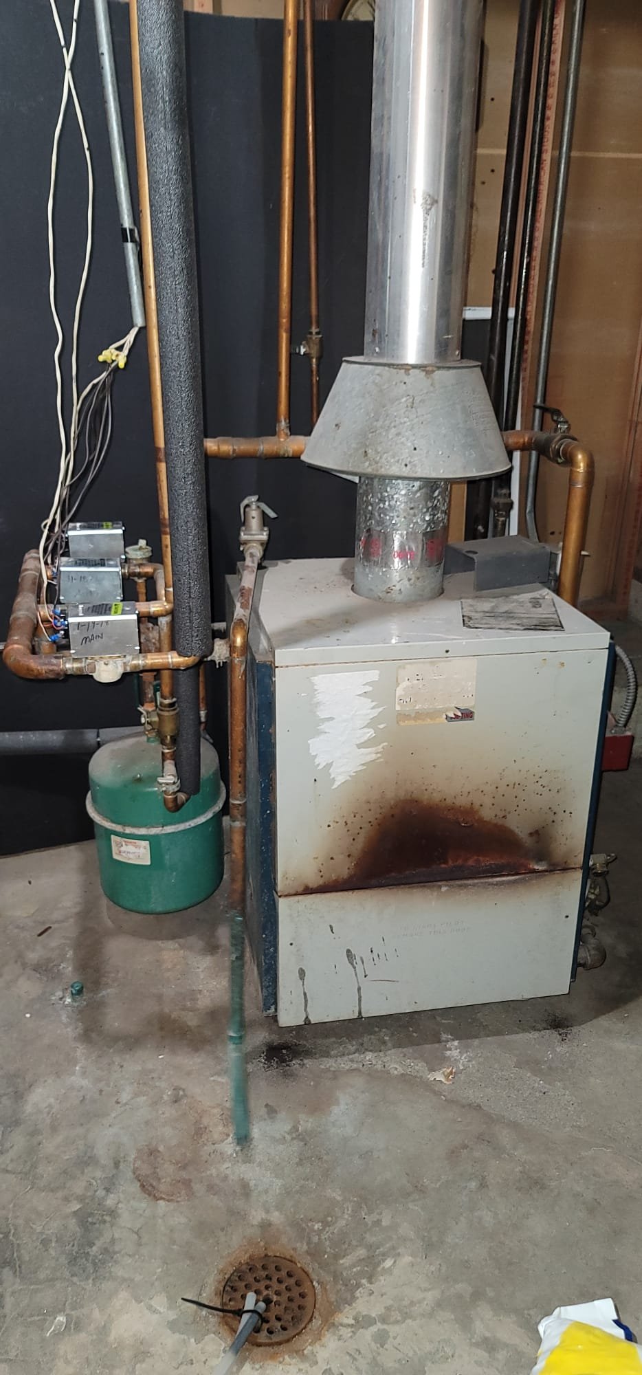 Image depicts wildfire support efforts, possibly showing firefighters or volunteers assisting communities affected by fire soot and sut from fire damage. The scene may highlight the aftermath of a wildfire, with visible soot-covered landscapes or structures, emphasizing the urgent need for aid and recovery.