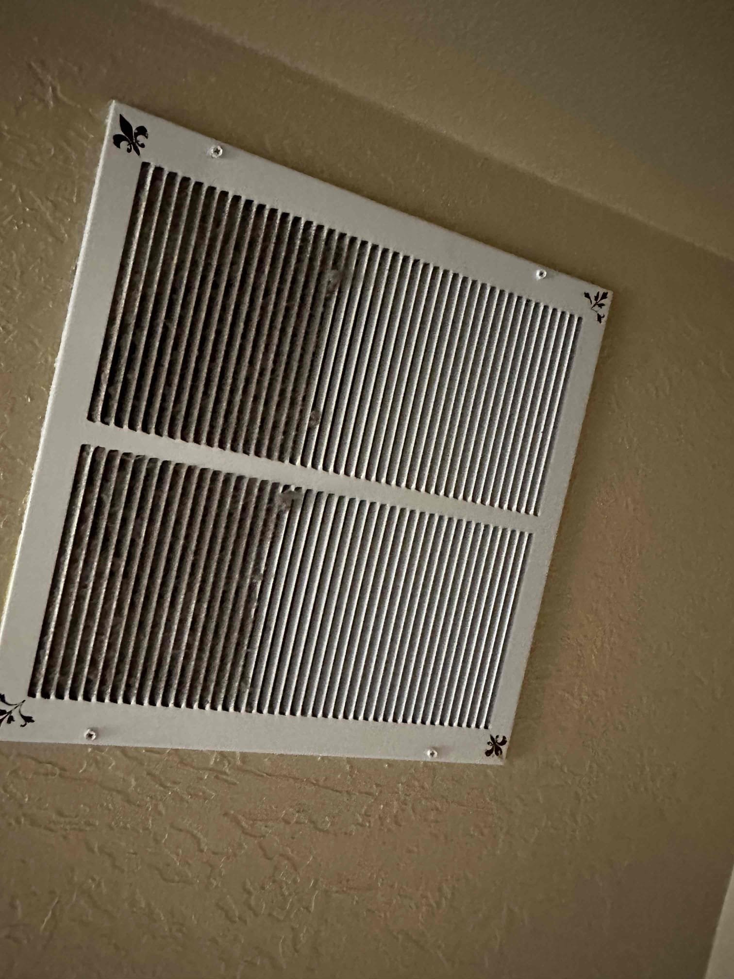 Image depicting the process of cleaning smoke damage from walls and ceilings, highlighting the importance of professional smoke damage cleaning services to avoid issues like persistent odors or mildew smells, similar to when towels aren't properly dried after washing.