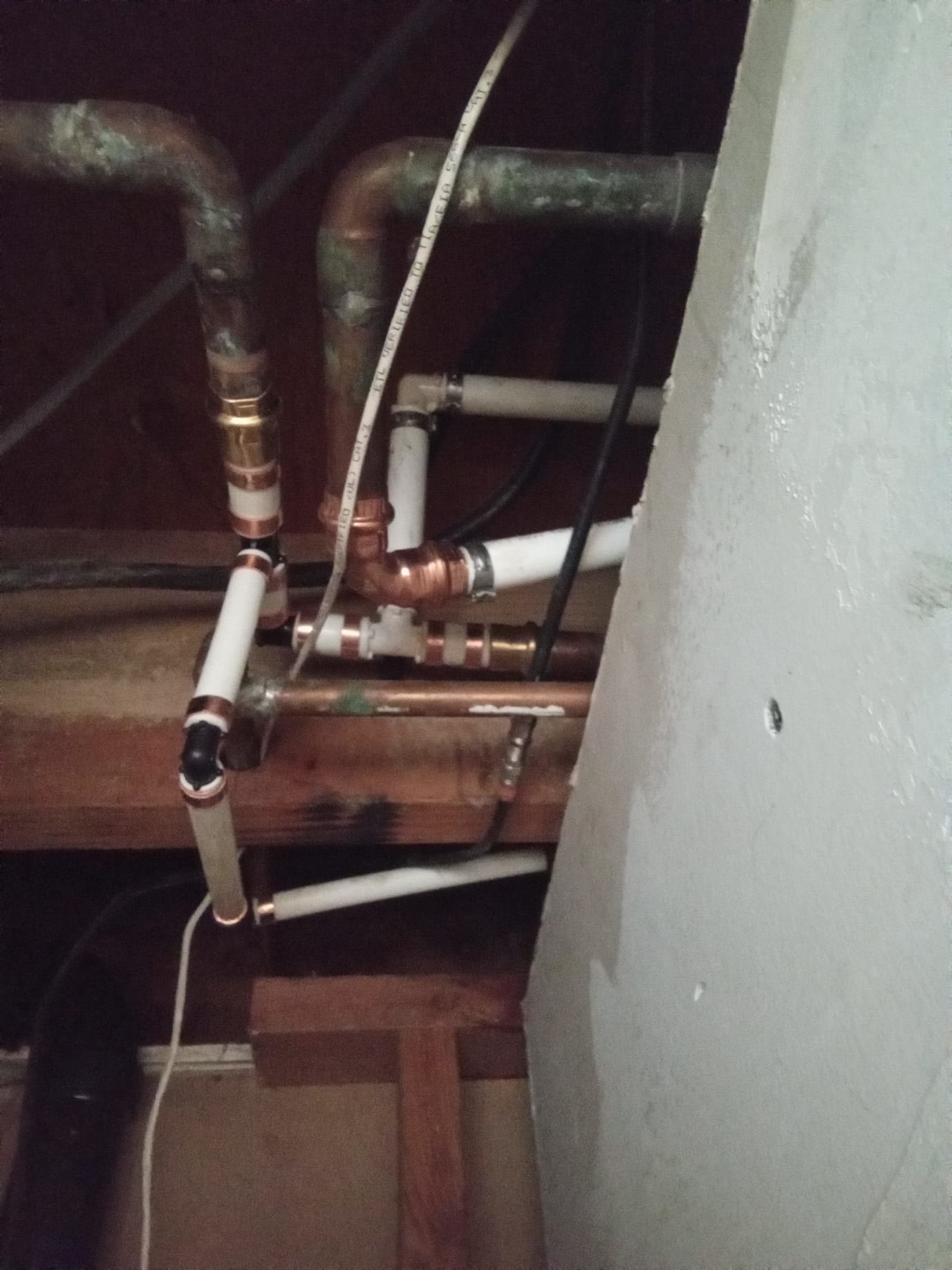 Image depicting a DIY water softener system installation. Focus on the ease of self-installing a water softener with a pre-existing water softener loop, simplifying the plumbing process and showcasing a complete water softener system installation.