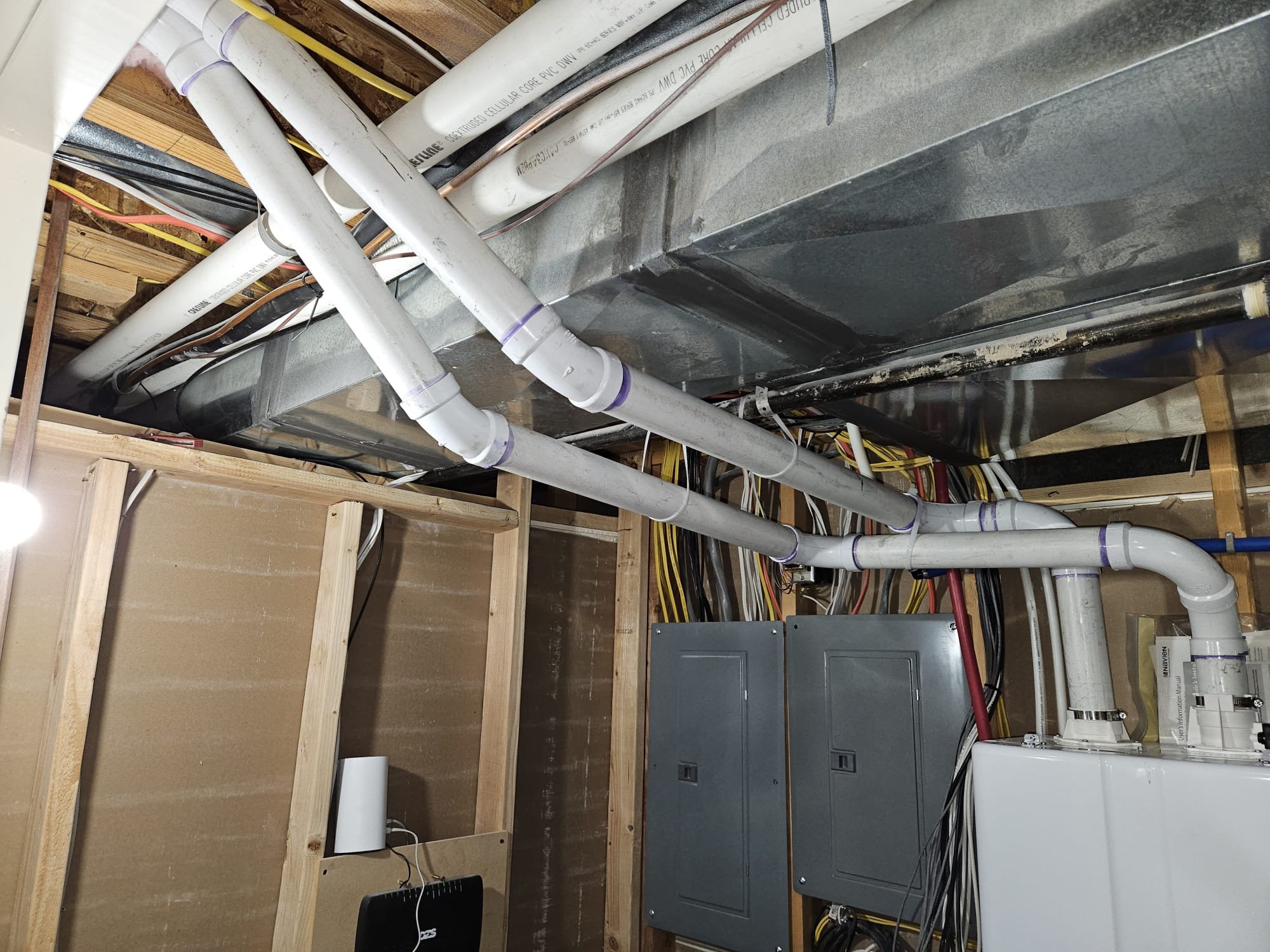 A modern, energy-efficient gas tankless water heater. This on-demand system provides endless hot water, saving space and energy compared to traditional gas water heaters with tanks.