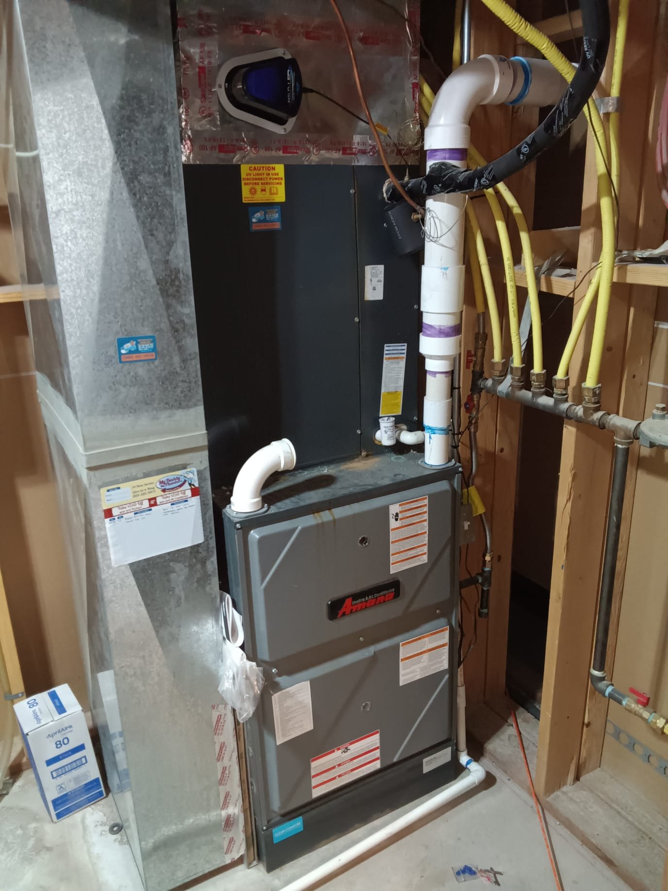 After-hours residential smoke odor removal in progress. A room air purifier for smokers is visible, highlighting residential smoke odor removal services nearby.