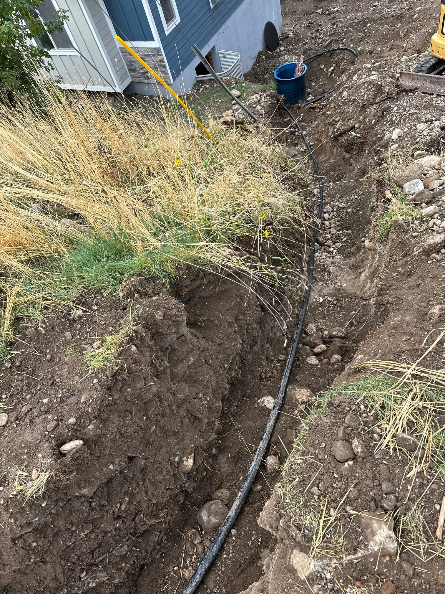 A stopped-up double kitchen sink, highlighting a common issue addressed by storm cleanup companies. Clogged drains and debris accumulation can overwhelm plumbing systems after storms, causing backups and requiring professional intervention to restore proper drainage and prevent further damage. A reminder that storm cleanup involves more than just outdoor debris removal.