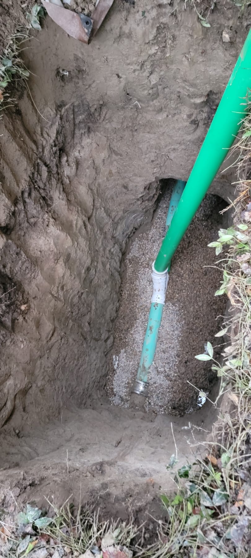 Image depicting flood recovery repair efforts possibly including a small outdoor wood stove amidst debris. May relate to flood recovery pricing for cleanup and restoration services.