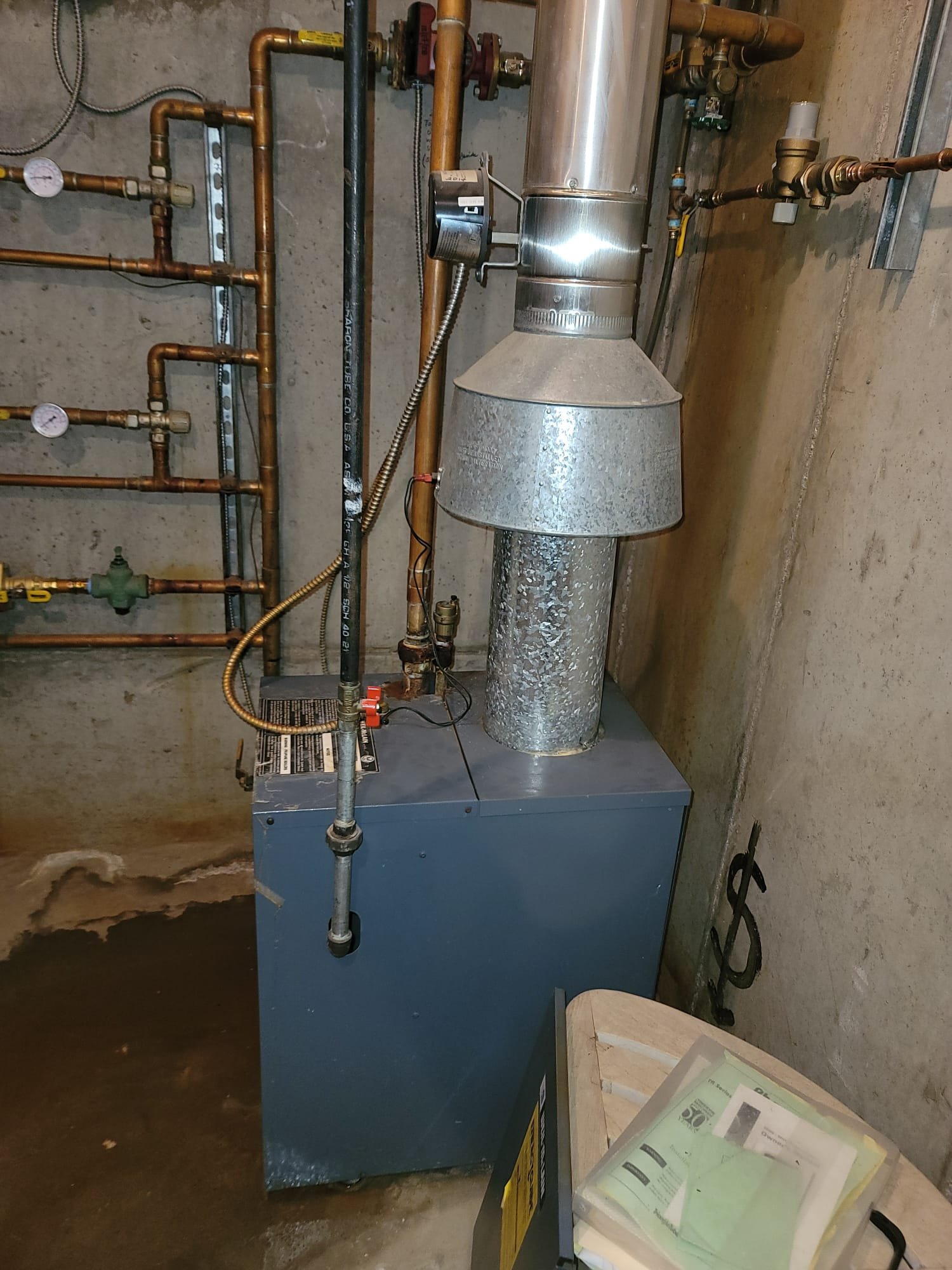 Image of a newly installed combination boiler, highlighting efficient hot water and radiator connections. Represents professional boiler installation services.