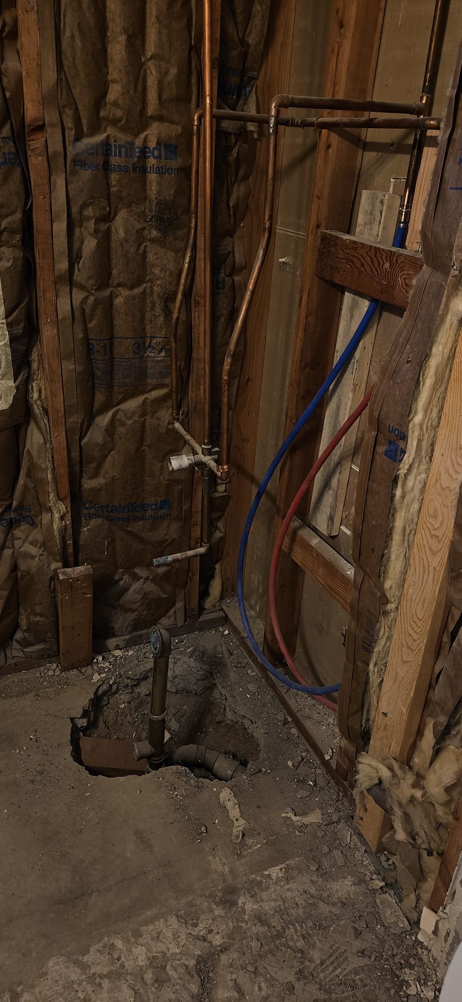 Image depicting disaster remediation repair work, potentially involving the restoration of a building damaged by a flood or fire. Could show workers removing debris, repairing structural damage, or cleaning soot. The presence of cast iron radiators for sale may be implied as part of a restoration project, raising questions about disaster remediation cost and whether salvaged radiators can offset expenses.