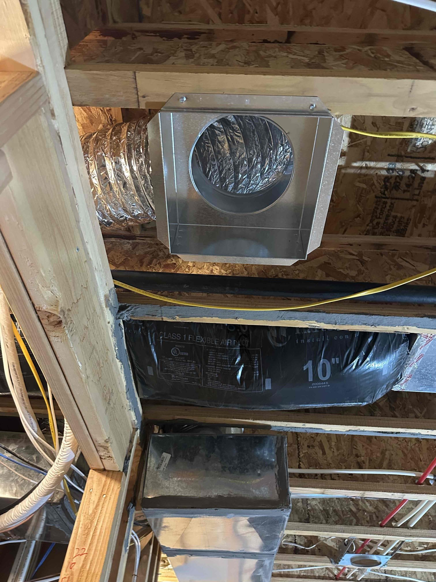 Image depicting a professional installing a reverse osmosis water filtration system in a home, with a subtle visual link to ductless AC installation, suggesting a holistic approach to home comfort and water quality. Search 'ductless AC installation near me' or 'reverse osmosis system installation near me' for expert service.