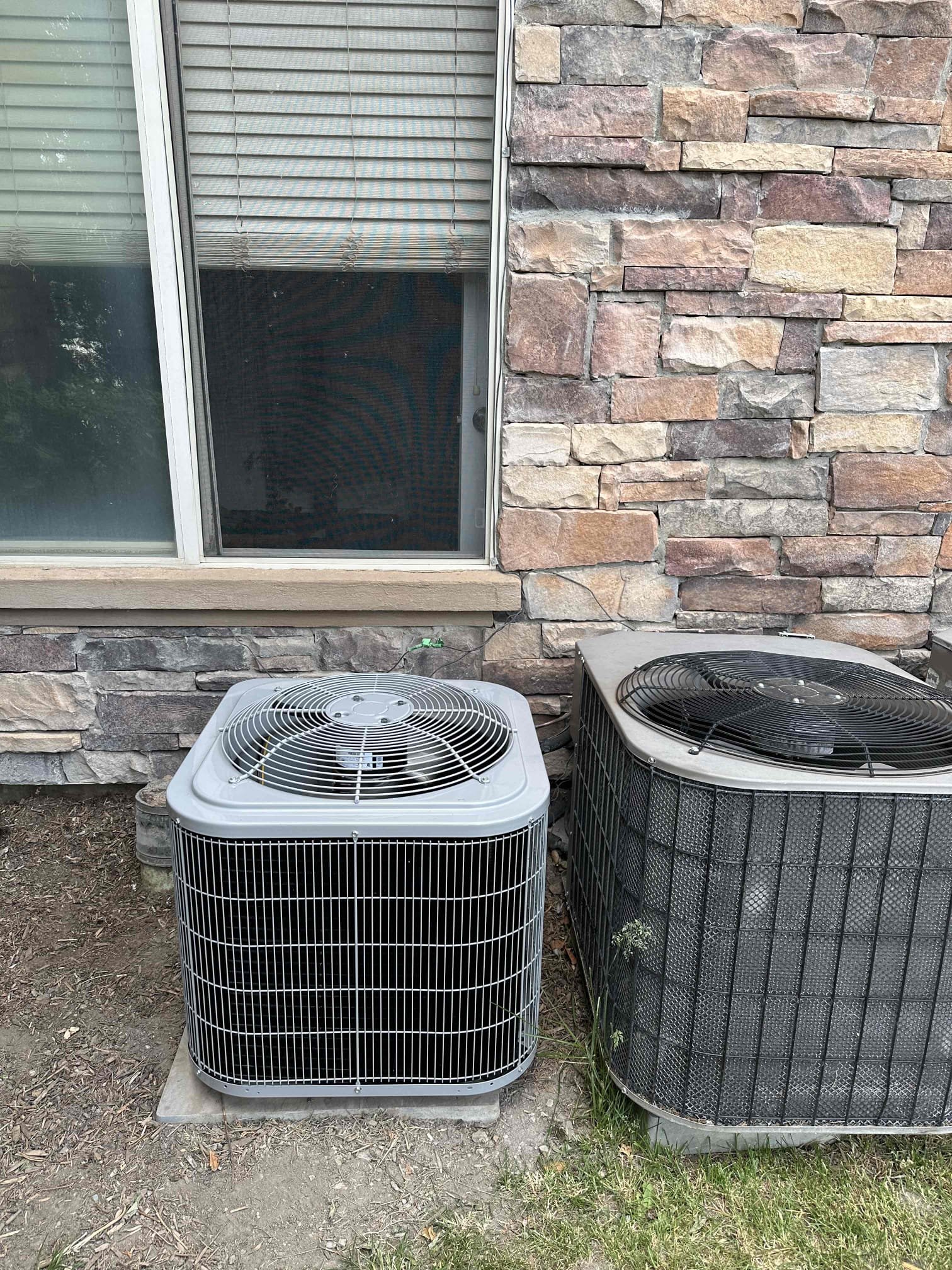 Image of a dual air conditioner setup, often installed by commercial air conditioning installation services, ensuring efficient climate control for businesses.