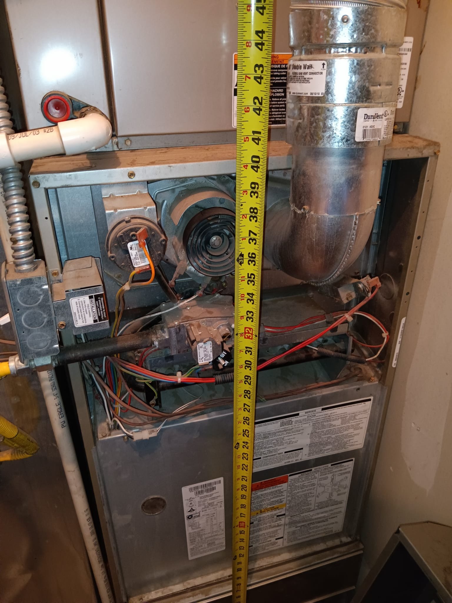 Image depicting a carrier furnace blower motor replacement, a common repair also applicable to York furnaces. Understanding blower motor issues can help avoid the higher gas furnace replacement cost.