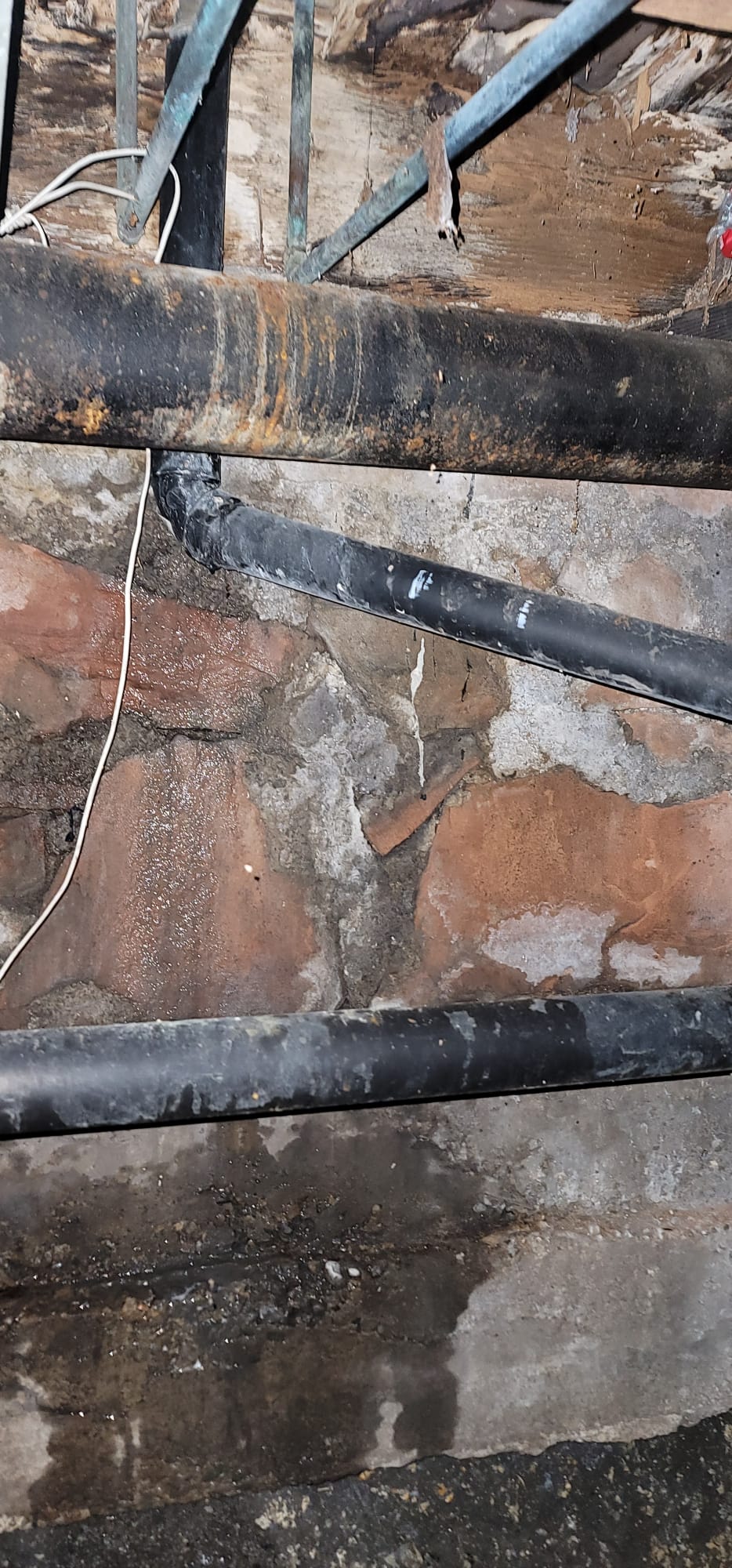 Packaged terminal unit (PTAC) on a building exterior. Proper HVAC maintenance prevents water damage, reducing the risk of needing water backup insurance or sewage backup service due to condensate leaks and potential flooding.