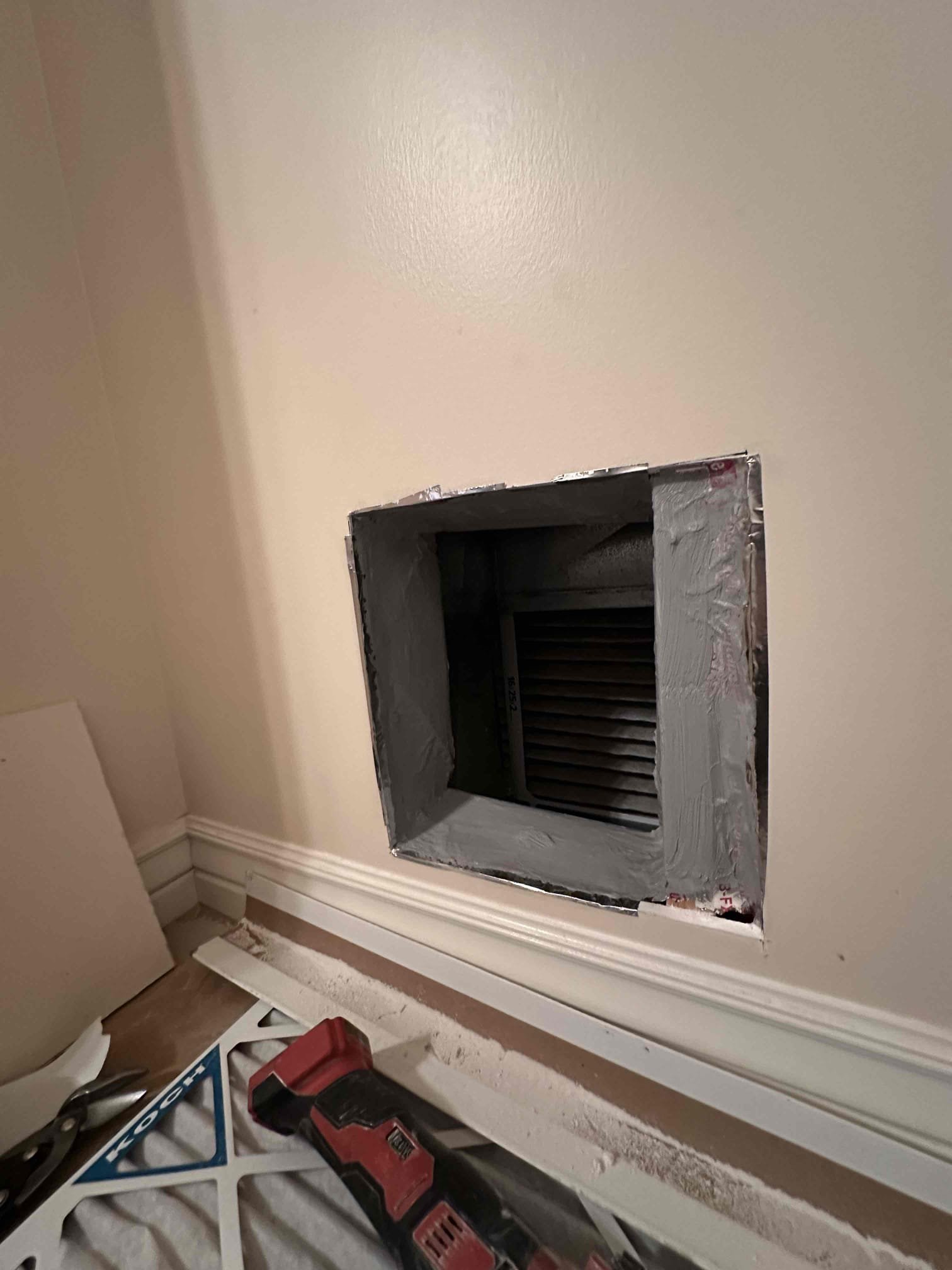 Image of HVAC technician repairing or sealing air ducts, reflecting ductwork cleaning and repair services for improved air quality and energy efficiency. Find 'air duct cleaning services near me' to maintain a healthy home environment.