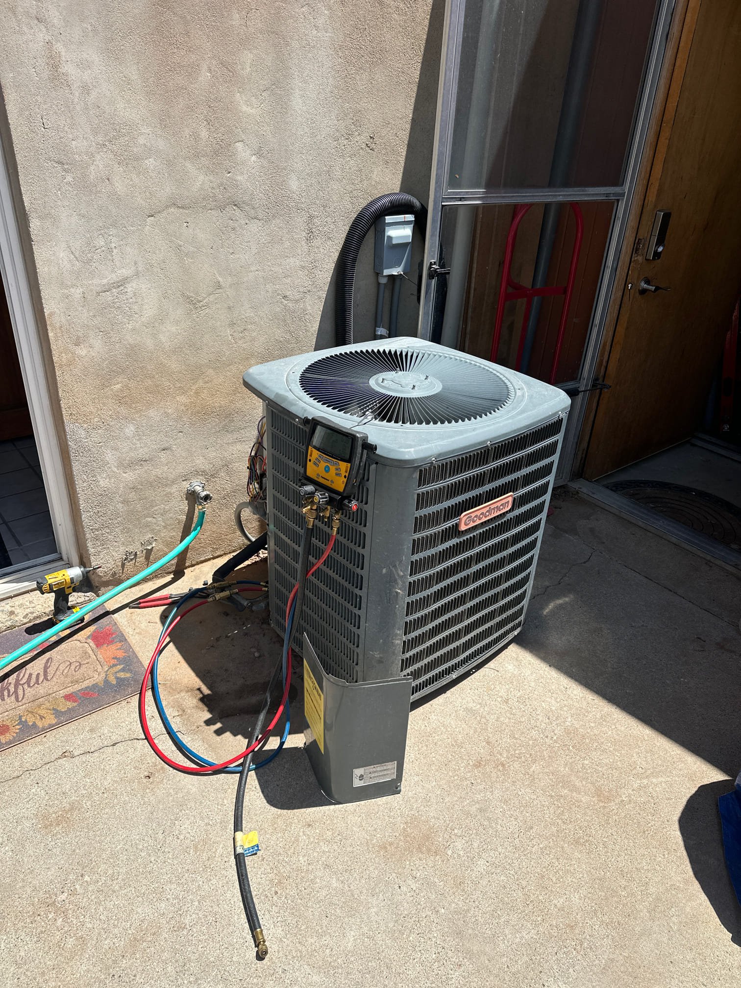 Close-up of an AC compressor, a vital component in gas-powered and Mitsubishi AC units. This device pressurizes refrigerant, enabling efficient cooling.