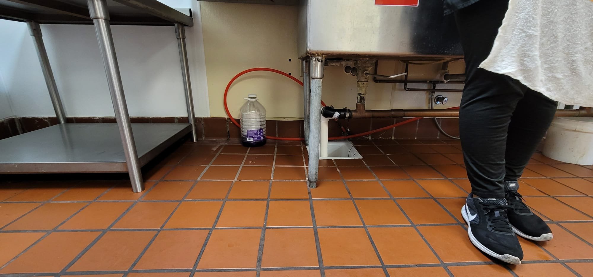 Image depicts fire odor removal, highlighting the importance of addressing dangerous smells, similar to a malfunctioning P-trap, by using licensed professionals to ensure a safe and thorough odor elimination, impacting the overall cost.