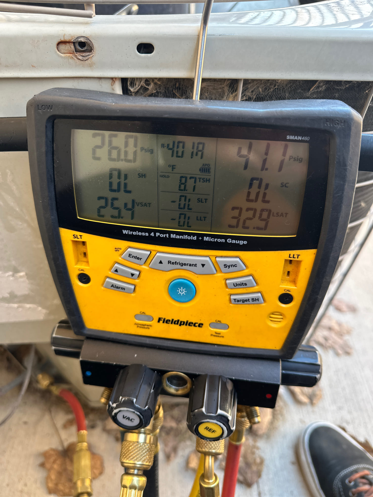 Image of an AC technician in West Jordan, Utah performing an AC tune-up. Regular AC maintenance, like this, helps keep your 2-ton AC unit running efficiently. Find local AC repair services near you for optimal cooling performance.