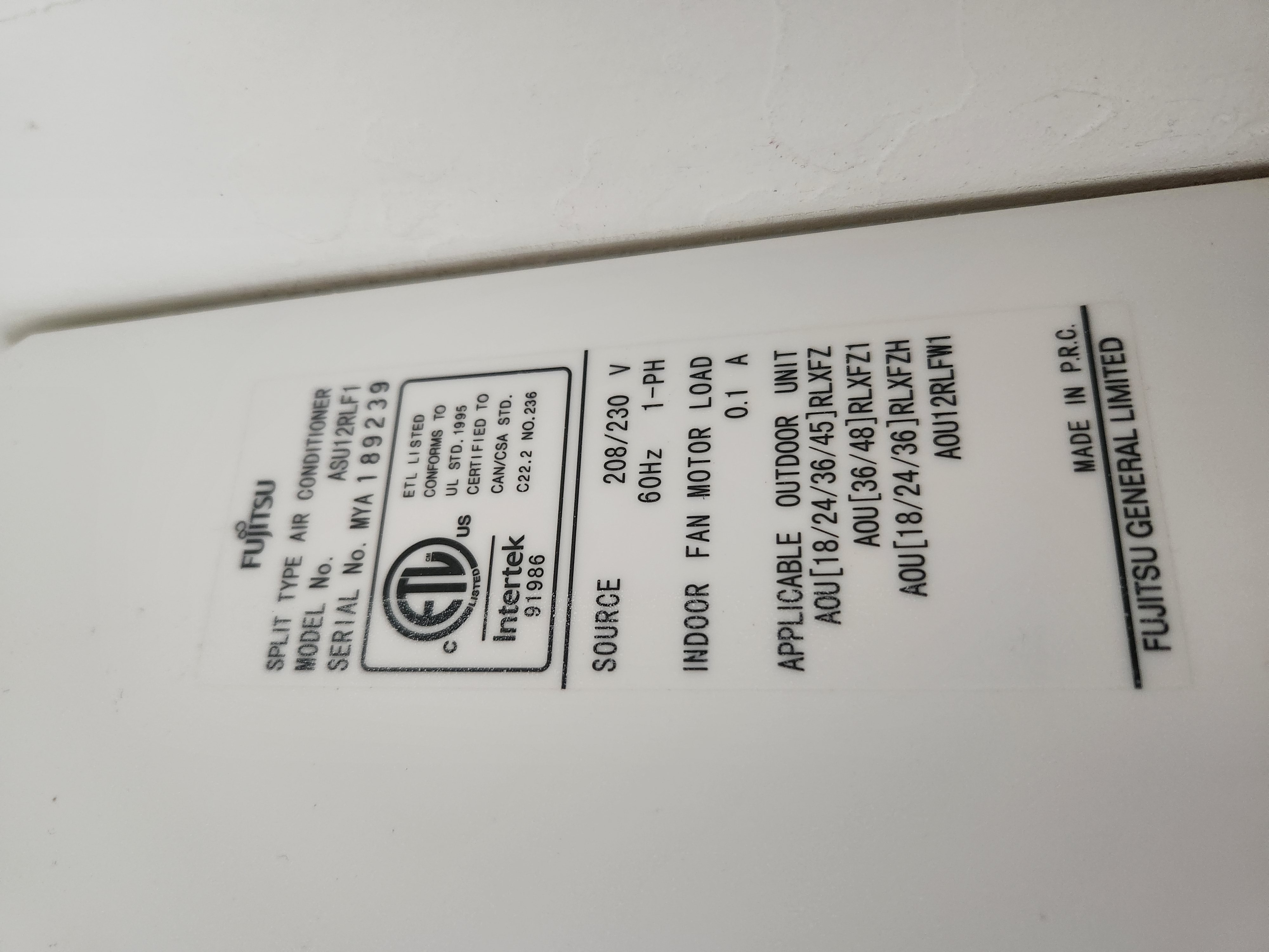Residential AC unit being inspected for replacement or repair, potentially including a recharge, to ensure optimal home cooling efficiency.