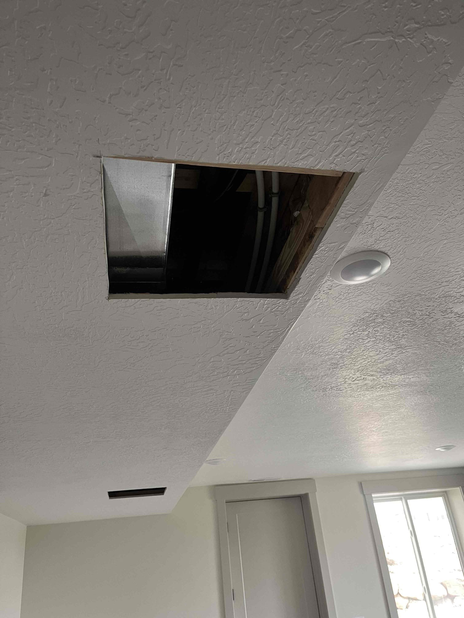 Image showcasing the concept of water softening, potentially depicting a DIY soft water system installation or contrasting it with the aftermath of commercial drywall water damage, emphasizing the importance of affordable water softening solutions to prevent costly repairs.