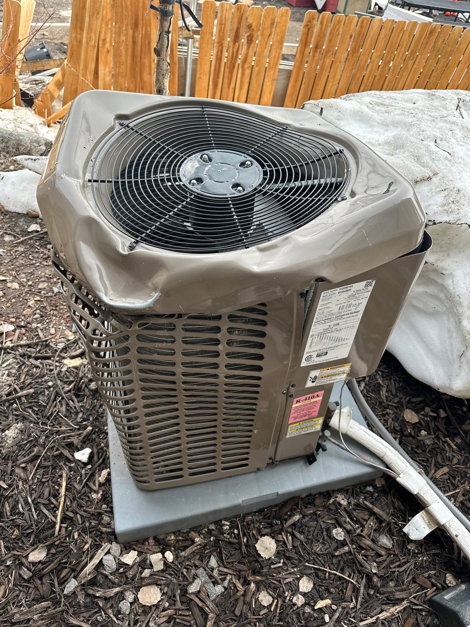 Image depicts a technician repairing a window AC unit, highlighting 'window AC repair near me'. Consider 'AC repair financing' options for affordable solutions to get your 'window AC unit repair near me' handled quickly and efficiently.