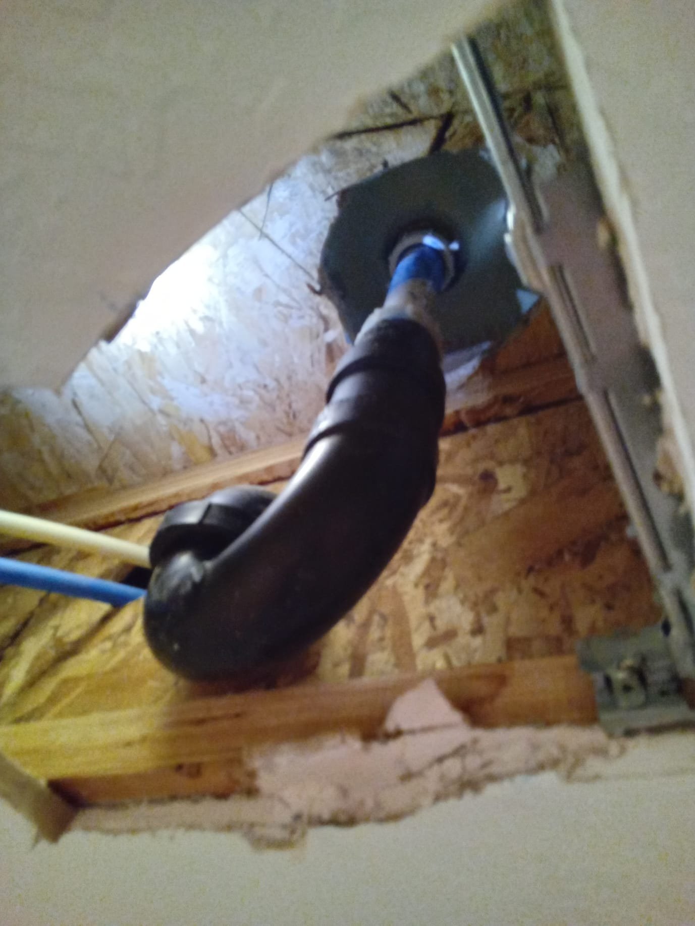 Image of a 100 ft drain snake, a powerful tool used by clogged drain cleaning services to clear collapsed drains and restore proper flow.