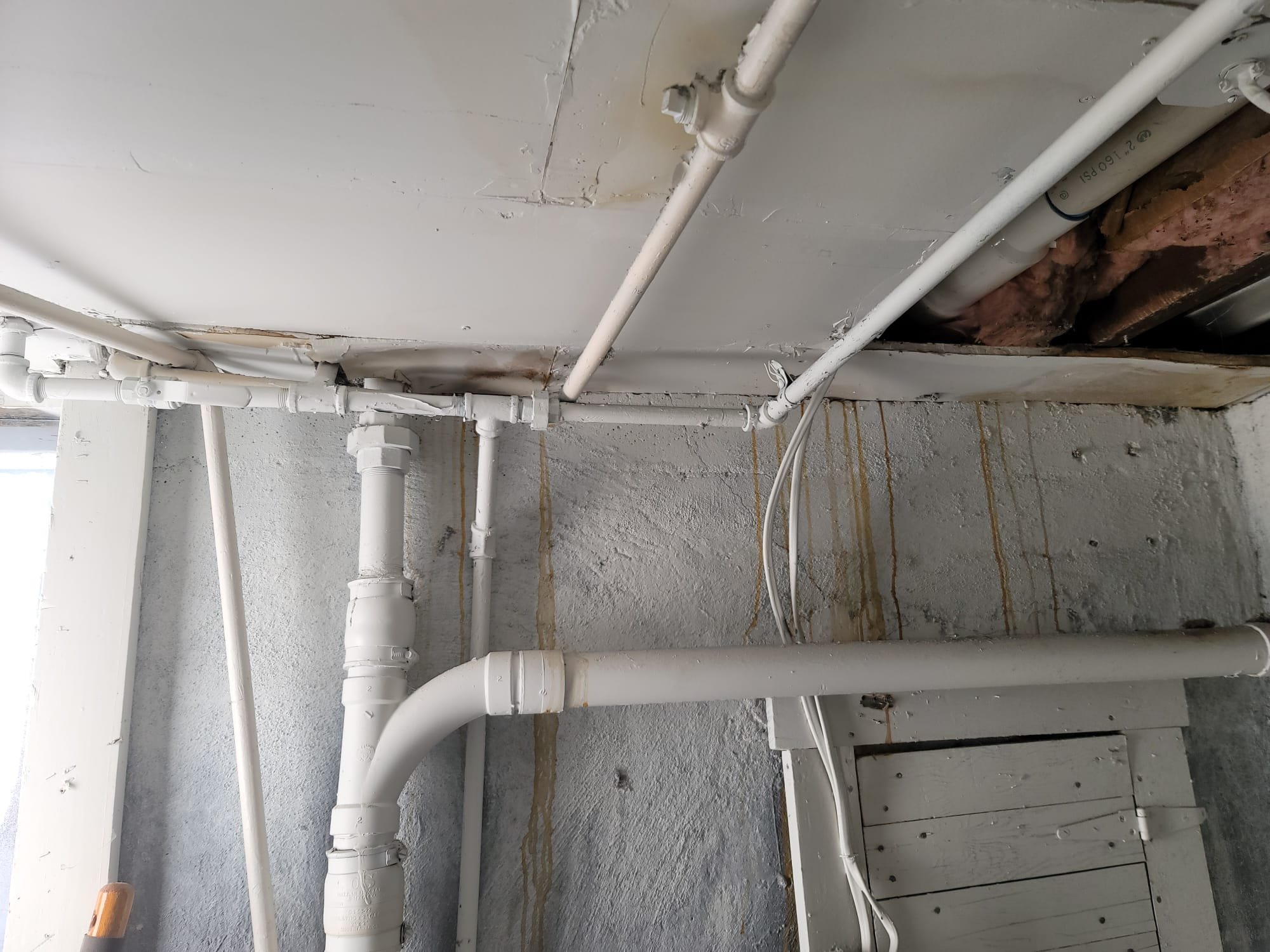 Image depicting solutions for commercial drywall water damage, odor removal, and associated costs. Might show water softener options to prevent future water issues, alongside a commercial drywall water damage odor removal estimate or a damaged commercial building interior.