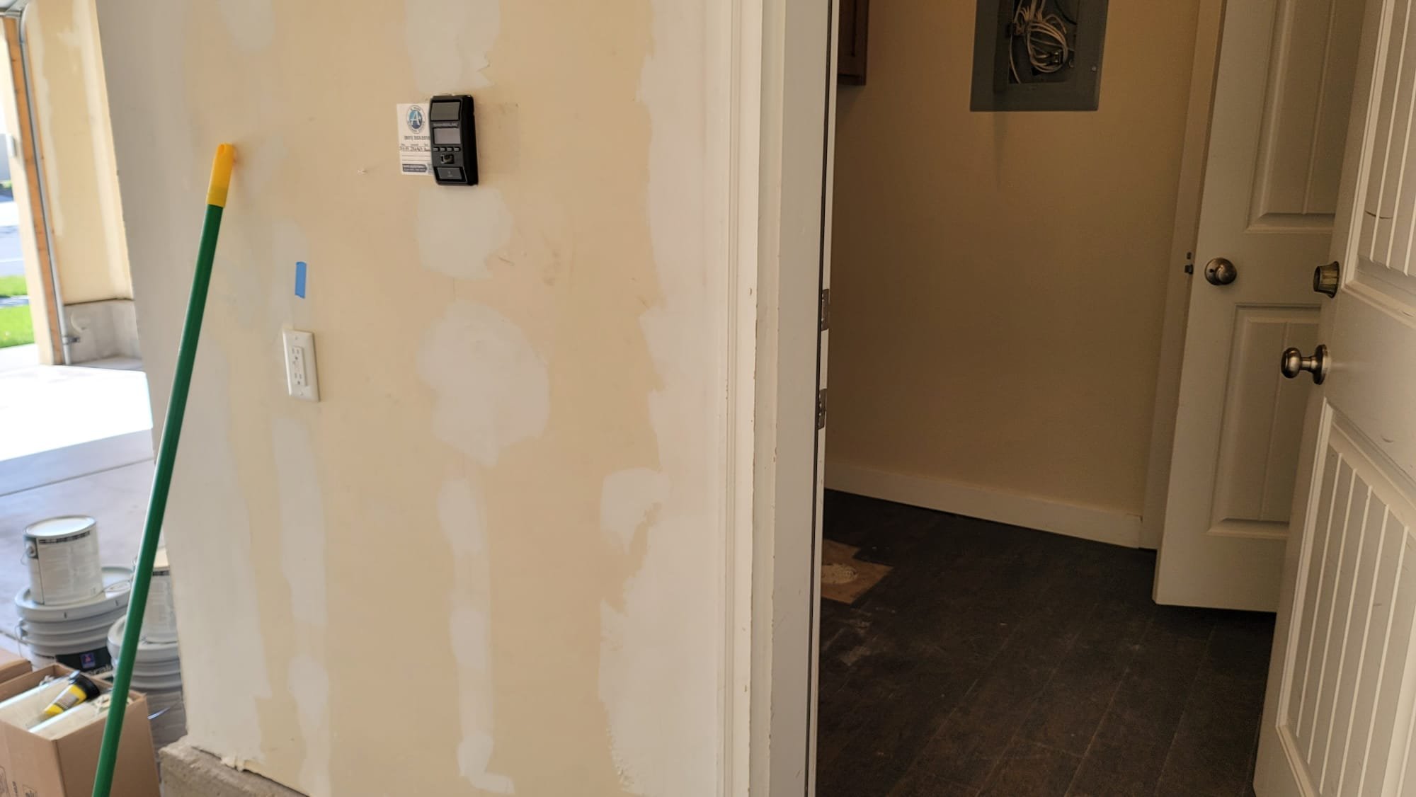 Concerned homeowner contemplating bathroom remodel costs. Image depicts a small bathroom with visible signs of wear, potentially including mold. Text overlay asks 'How much will it cost to remodel a small bathroom?' linking to resources about bathroom remodel cost estimation and mold remediation services.