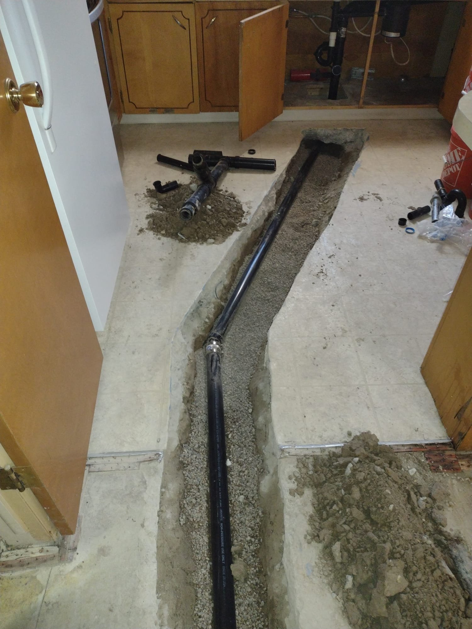 A basement water damage inspection reveals signs of hardened water damage requiring basement water damage repair. Visible water stains and mineral deposits indicate the presence of hard water, necessitating professional assessment and remediation to prevent further structural issues.