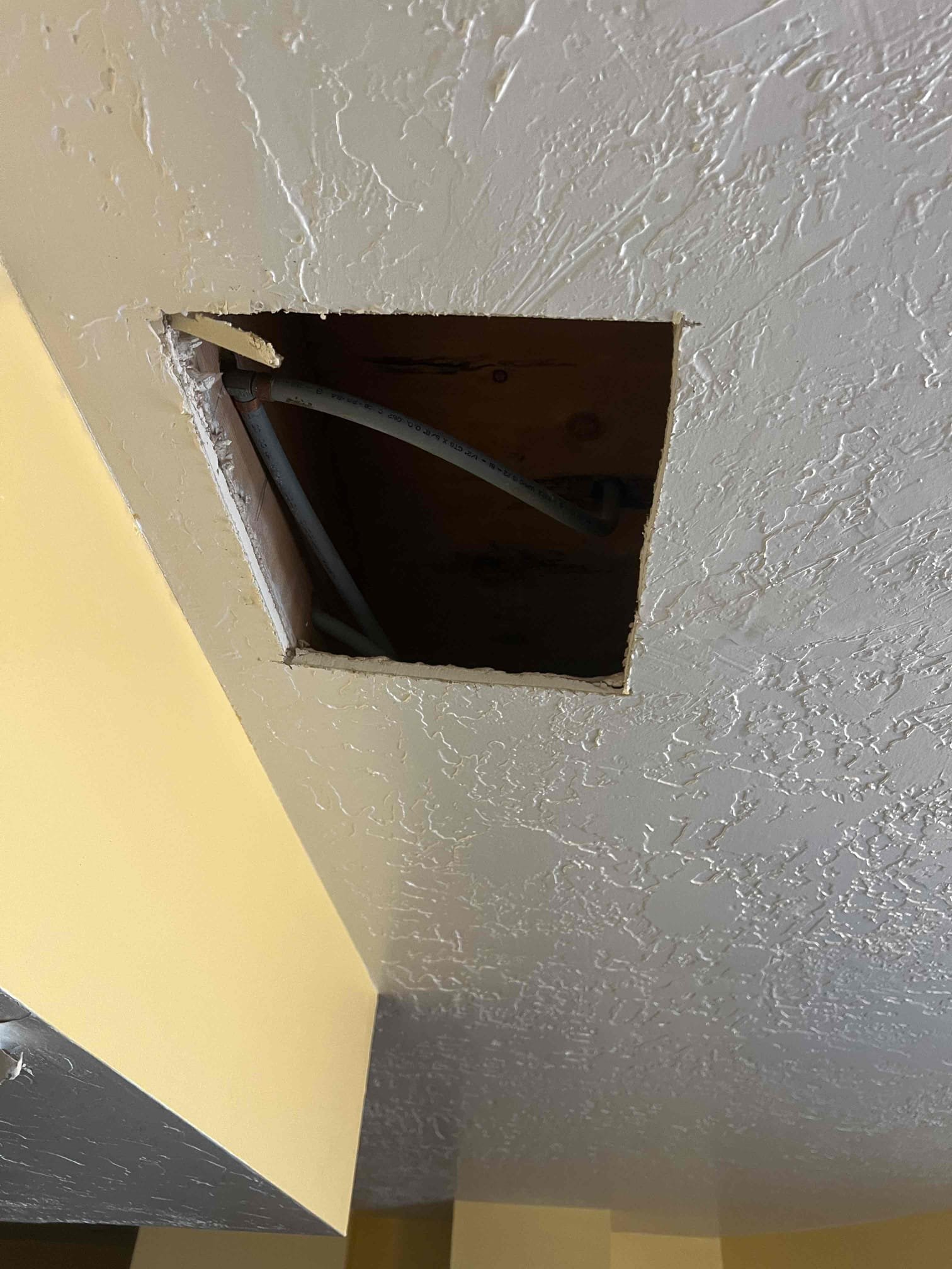 Residential flood cleaning inspection underway after water damage. Assessing floor cleaning needs and considering whole house water filtration system reviews for preventative measures.