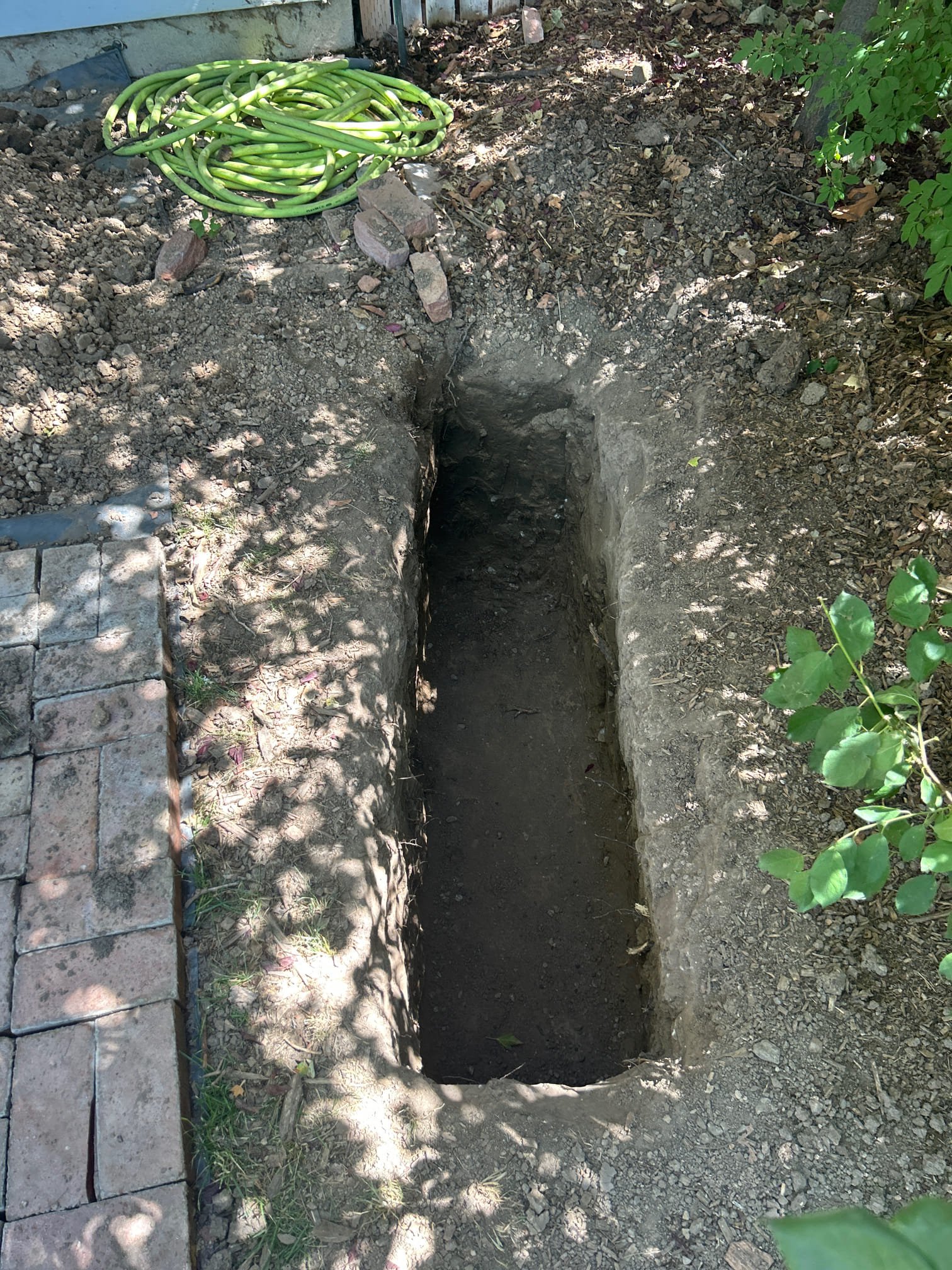 Residential service plumber working on a hot water heater. Expert plumbing contractor specializing in residential plumbing repairs and installations. Find the best electric hot water heater solutions near you.