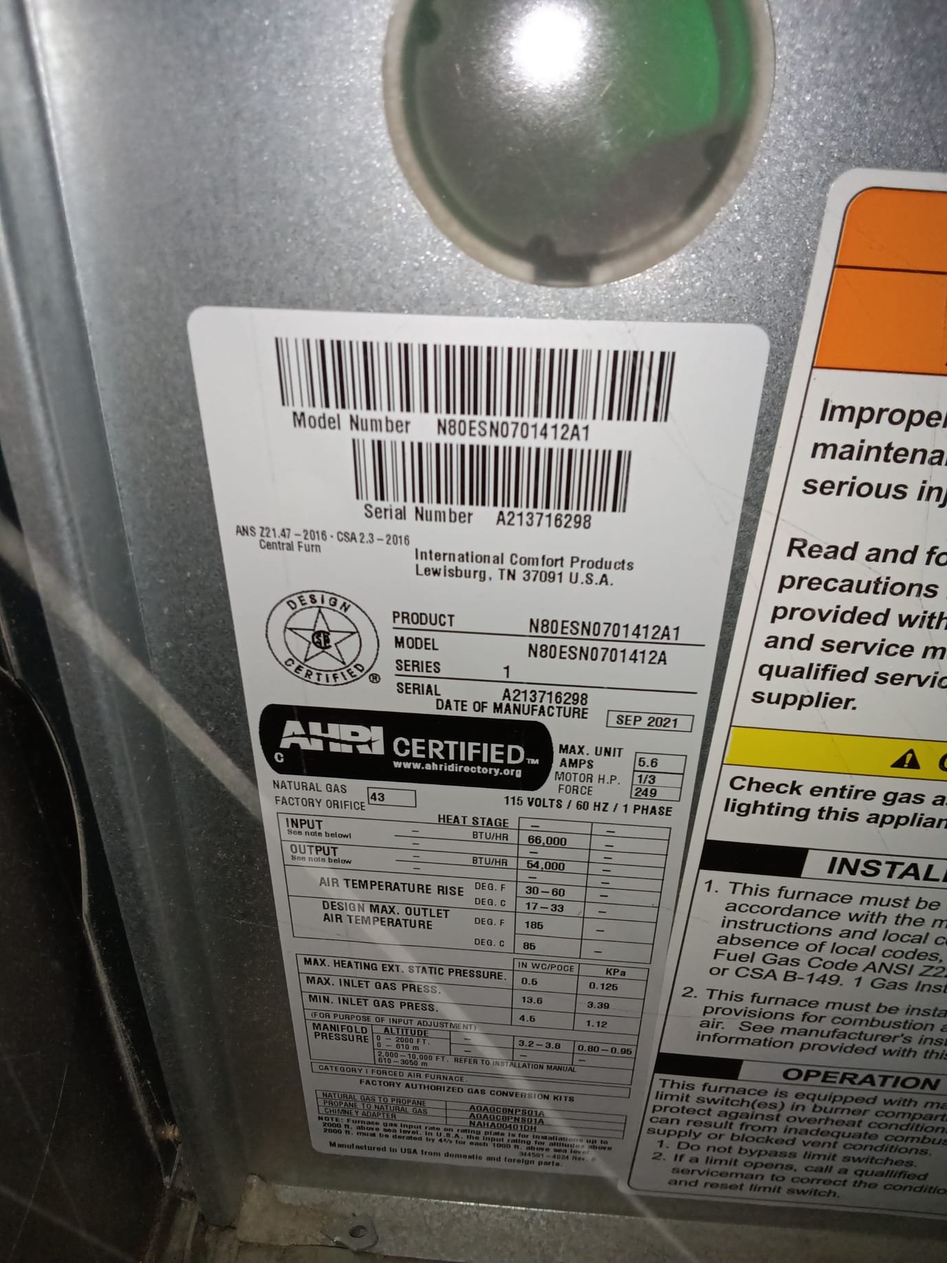 Close-up of an HVAC technician inspecting a ductless mini-split system. Emphasizes the importance of licensed ductless system inspections for cost-effective maintenance and preventing expensive repairs. Regular HVAC system inspections ensure optimal performance and energy efficiency.