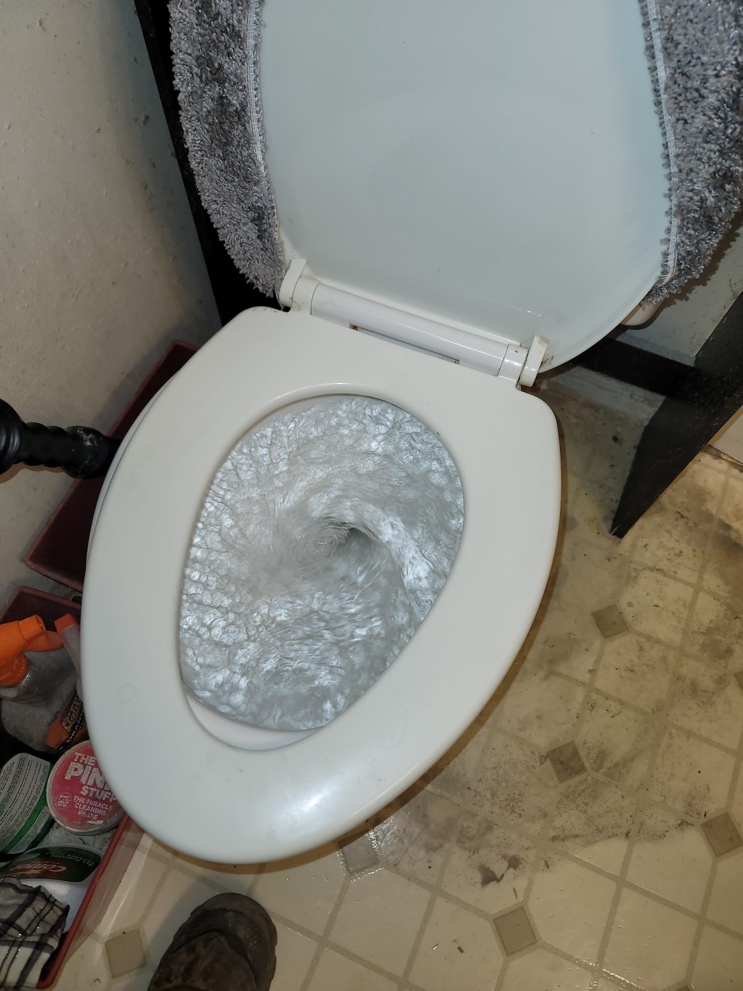 Image of a commercial bathroom showing mold damage, possibly near fixtures or hardware. Could relate to a mold damage maintenance service or estimate for repair.