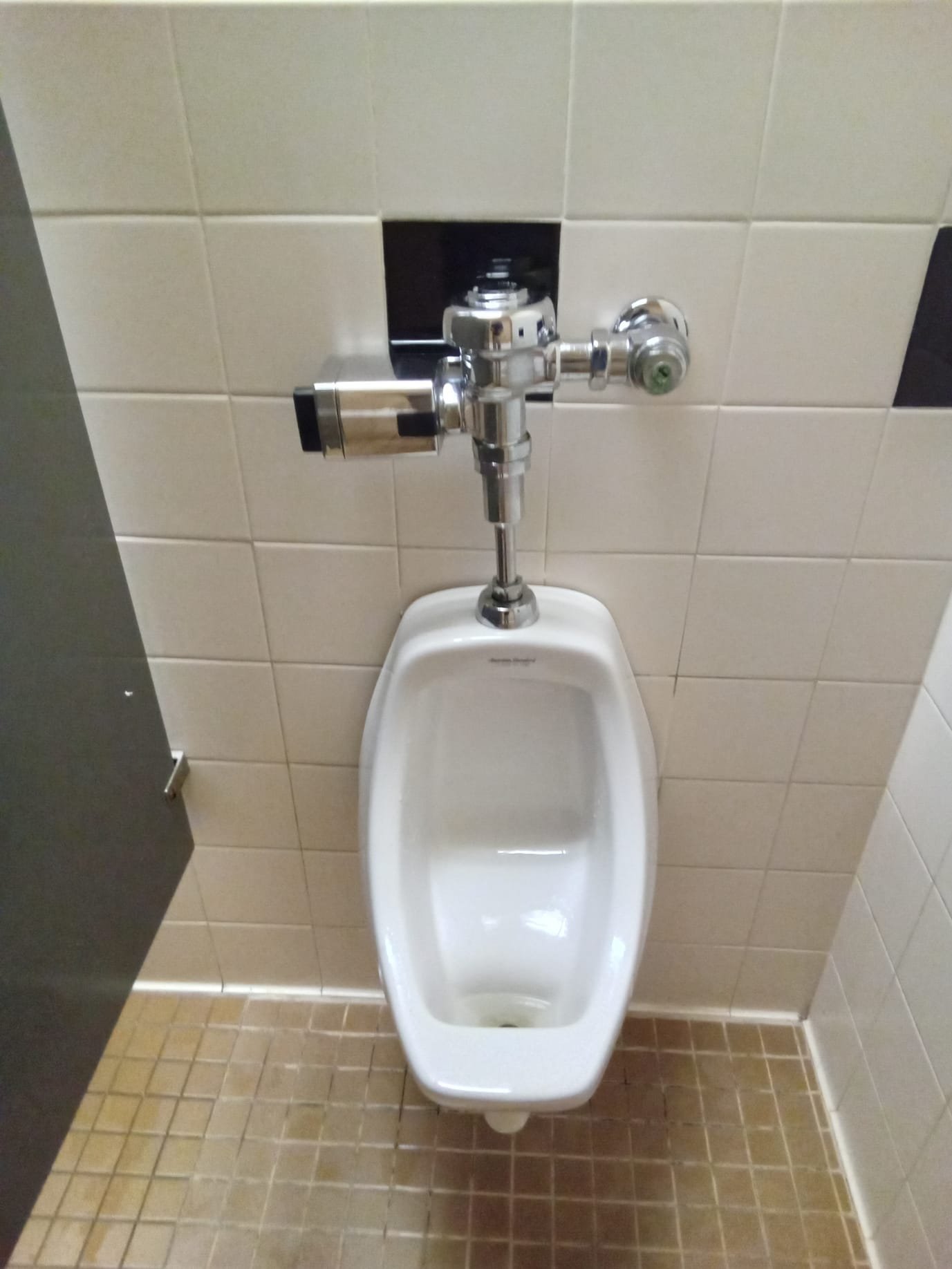 Commercial bathroom hardware components, including stall dividers and washroom partitions, essential for durable and accessible public restroom design.