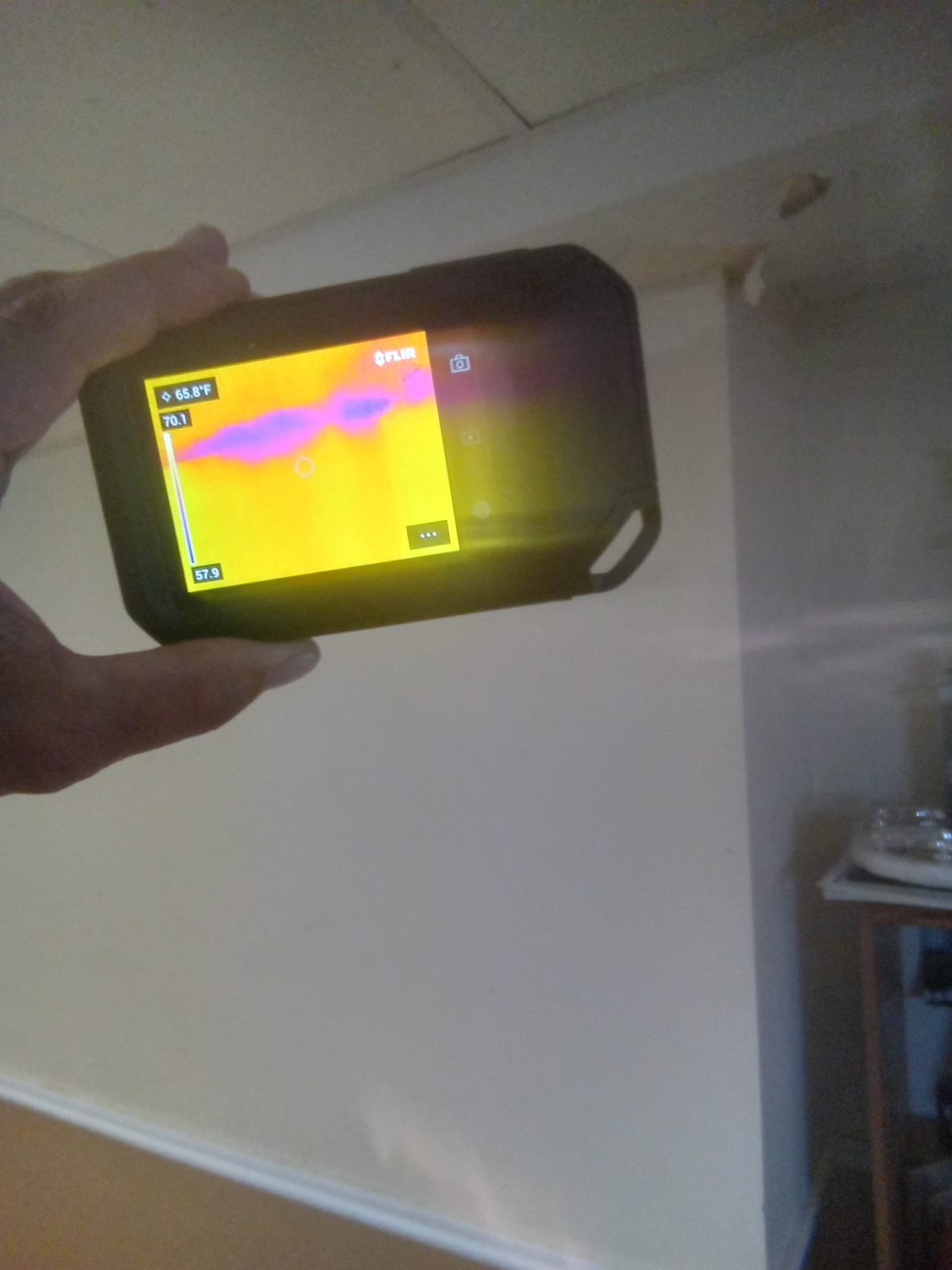 Hard water, rich in minerals, can cause scale buildup leading to water damage. Image depicts common hard water symptoms like spotty dishes and faucet scale, highlighting the need for water softening solutions to prevent costly repairs and protect your home.