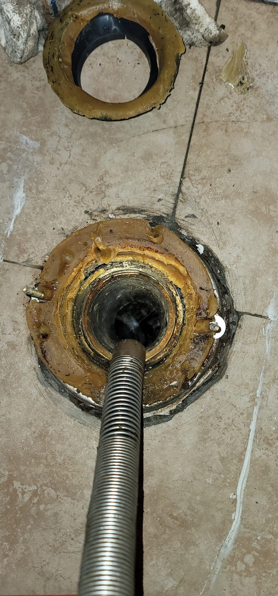 Image depicting a clogged main sewer line, potentially showing a sewer main cleanout location. Could be related to the cost of unclogging a main sewer line and the tools or methods used to resolve the blockage.