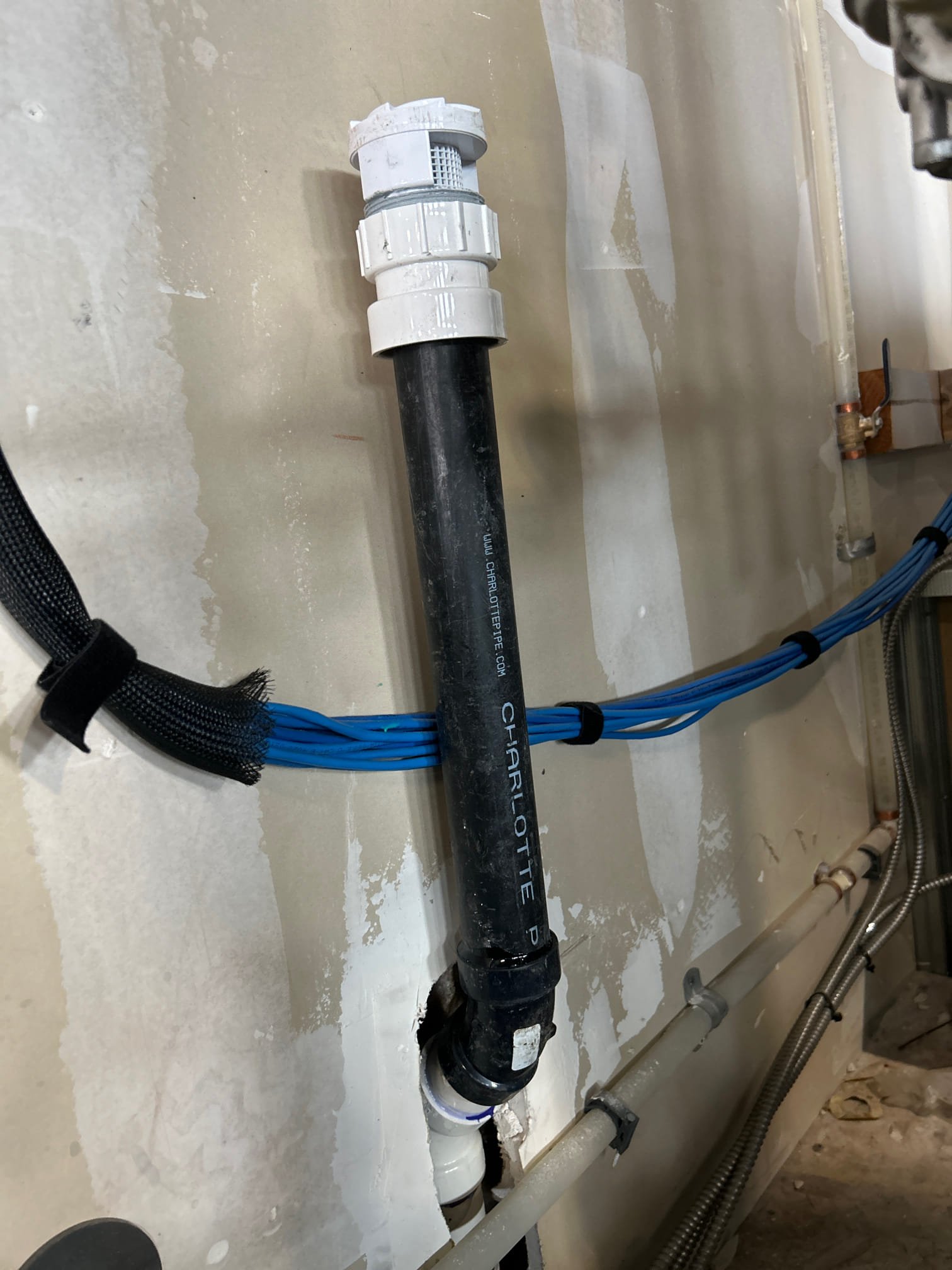 Basement drywall showing signs of water damage, highlighting the need for odor removal and troubleshooting. This image relates to solutions for water damage, including finding the best drinking water filter for hard water to prevent further issues, and understanding basement drywall water damage odor removal pricing for effective remediation.