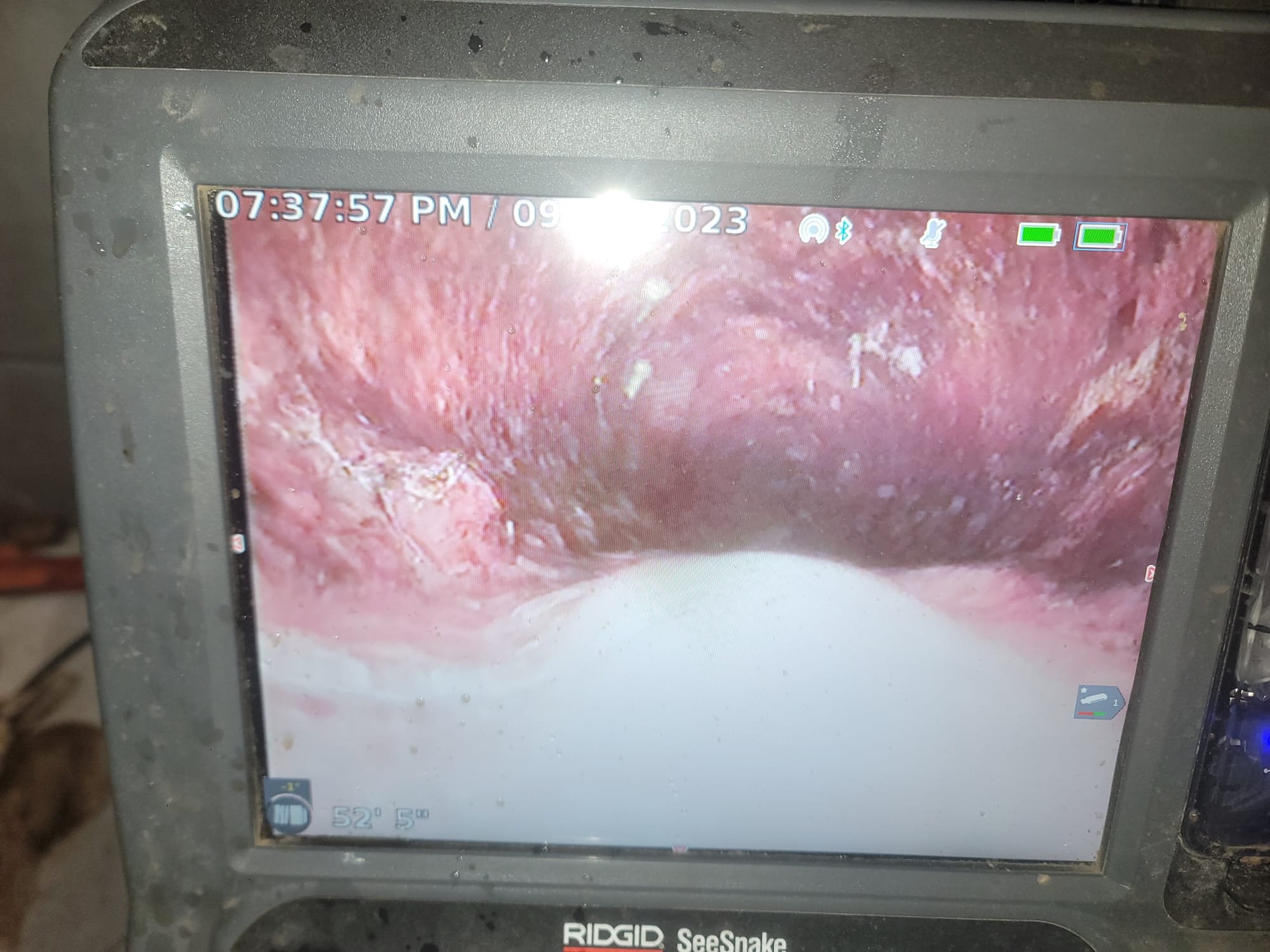 Sewer cleanout access point inside a home, part of the residential sewer line system. This sewer drain house connection allows for easy maintenance and unclogging of the main sewer line.