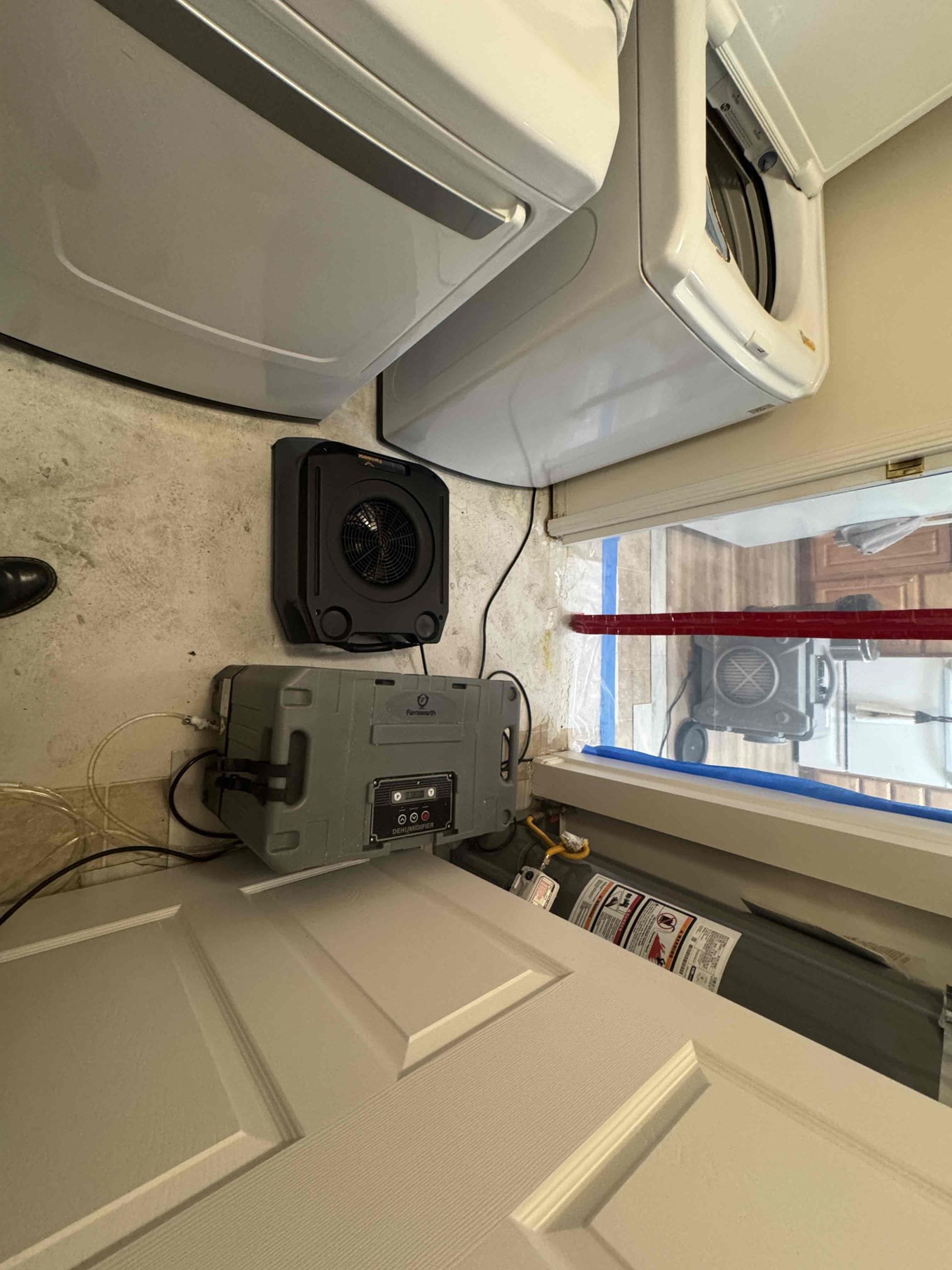 Flood restoration installation following a flood declaration. Image showcases equipment and processes used in water damage cleanup and drying, emphasizing the importance of professional flood restoration maintenance to prevent further damage and ensure a safe, healthy environment.