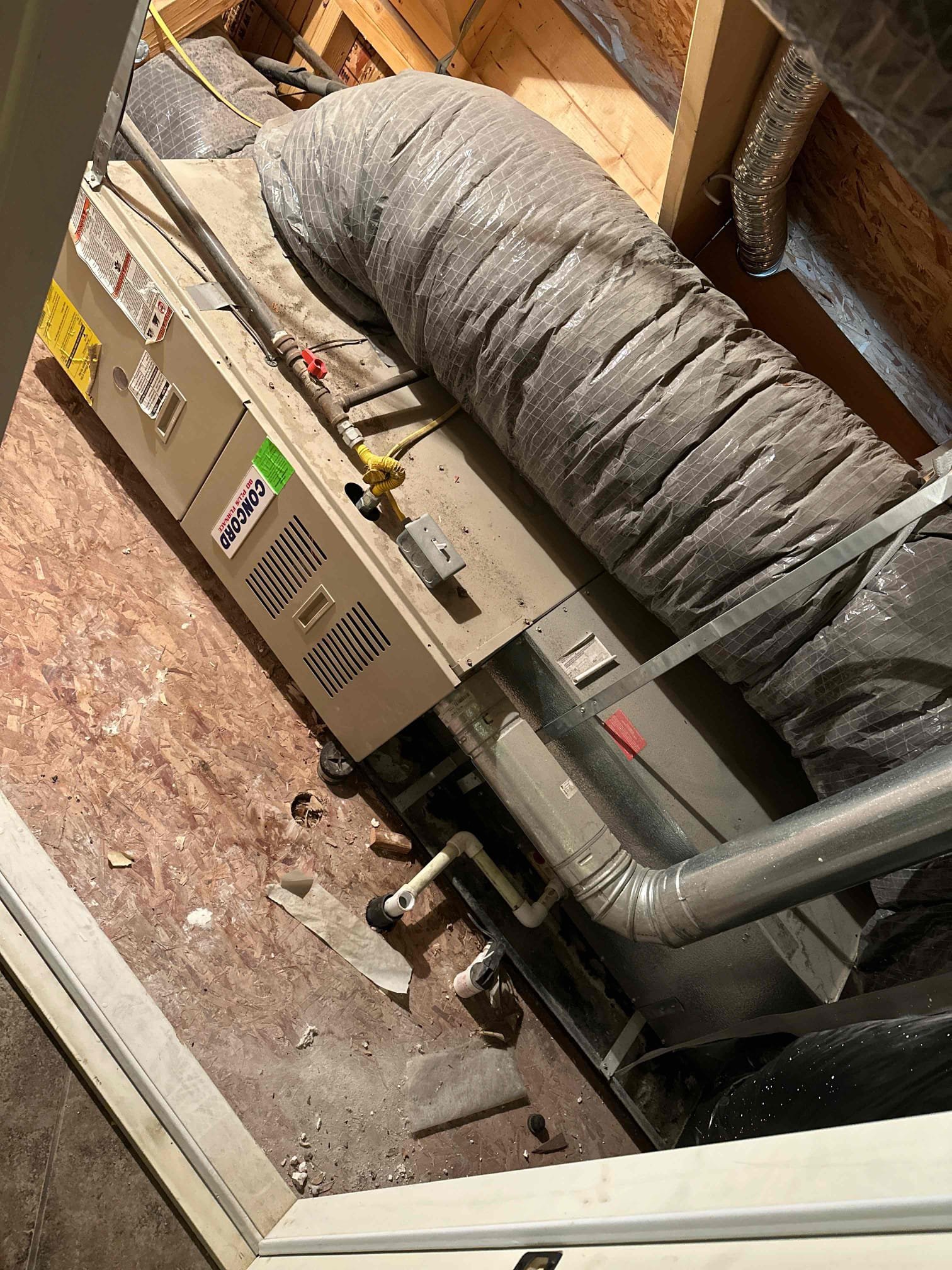 Image of a Goodman 4-ton HVAC unit, conceptually linked to toilet pipe cleaner and a toilet snake tool, symbolizing a powerful solution for clearing blockages, whether in home climate systems or plumbing. Represents reliable performance and effective problem-solving.