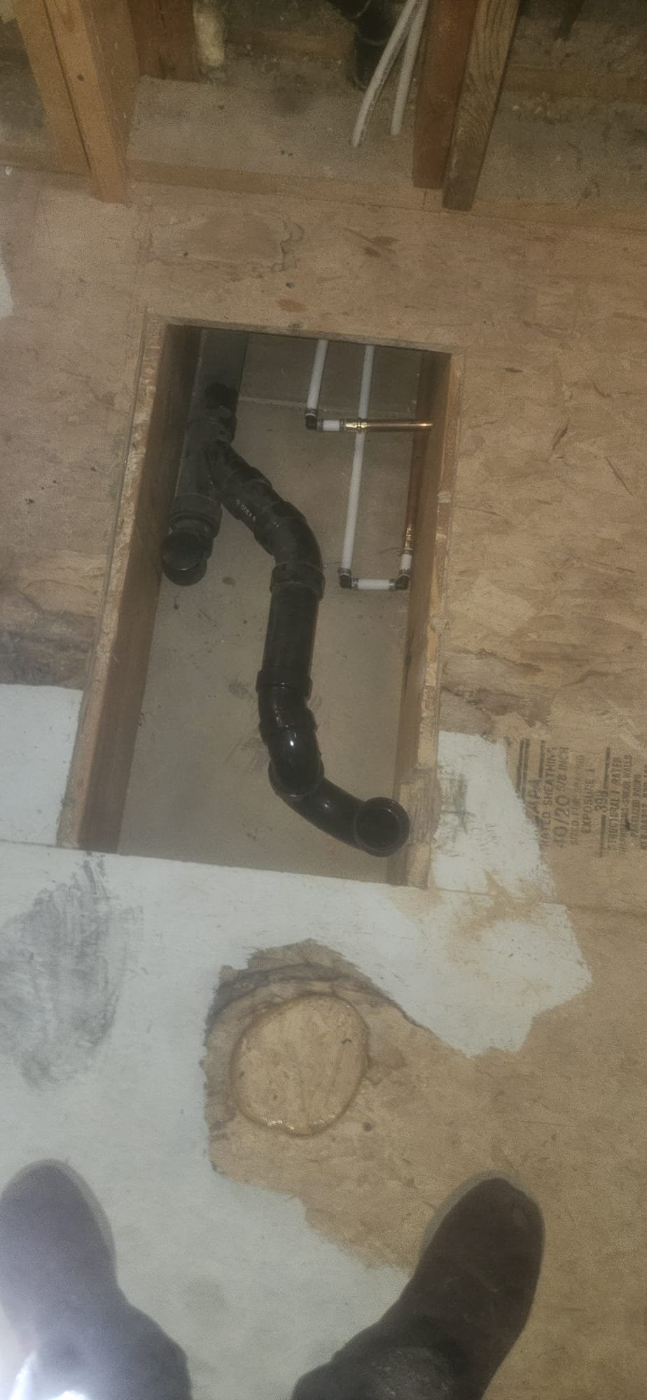 Affordable plumber replacing old, corroded pipes in a house. A cost-effective solution for updating plumbing in older homes. Find a local plumber near you for reliable pipe replacement services.