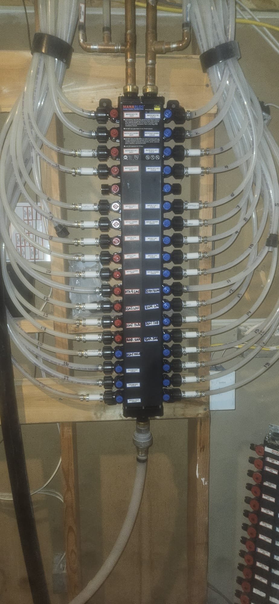 A Mitsubishi wall unit air conditioner is mounted on drywall, potentially highlighting the importance of proper installation and maintenance to prevent water damage that could necessitate drywall repair or ceiling drywall water damage fixes.