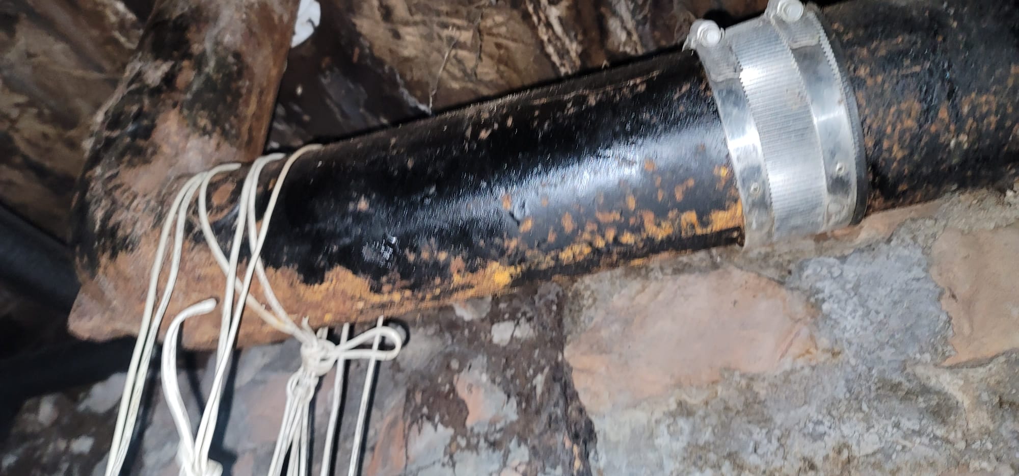 A clogged shower drain, often addressed by a clog remover for shower, can lead to unpleasant sewer odors. This image represents the need for solutions, from DIY clog removal to professional sewer odor removal companies.